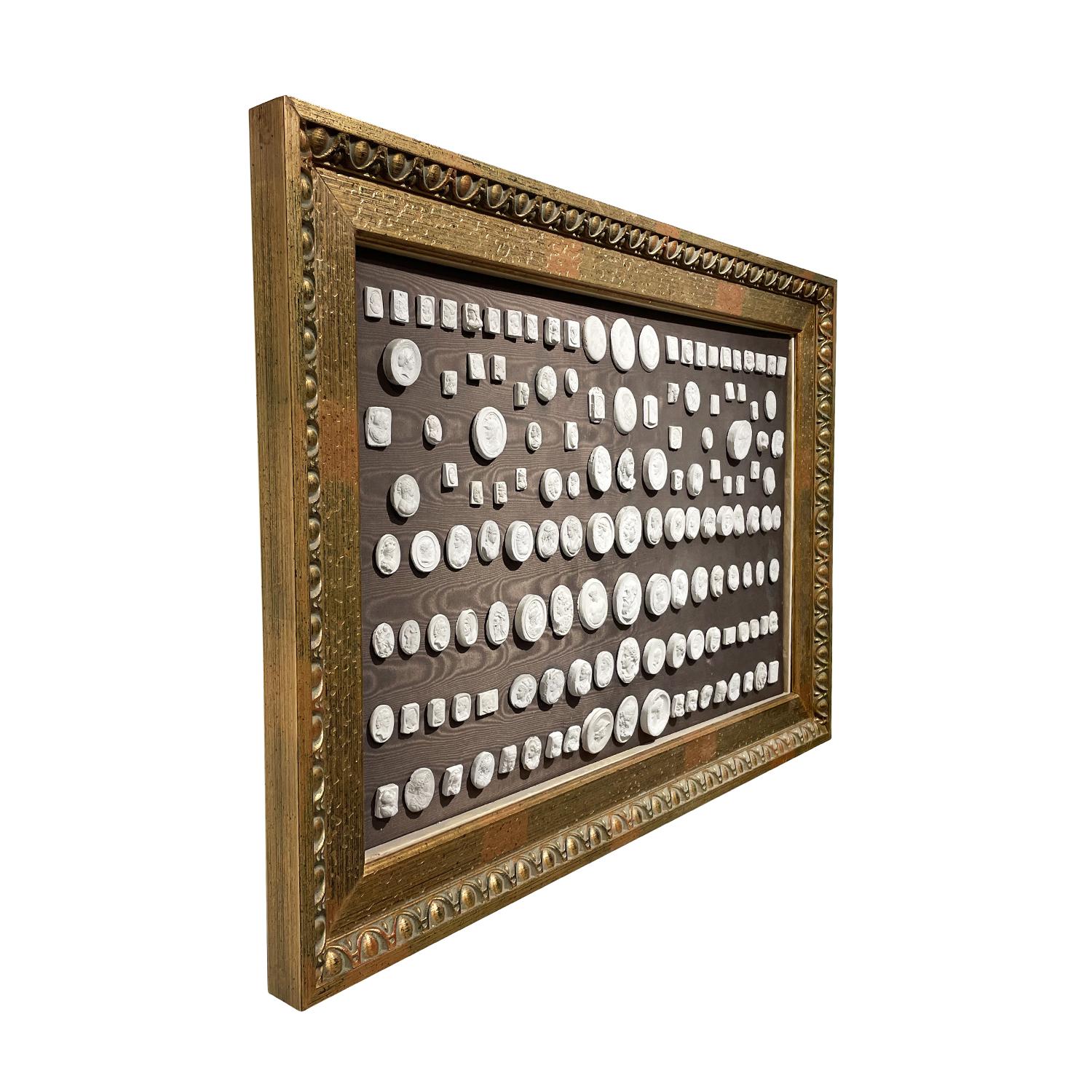 A vintage European gem collection of one hundred fourteen plaster casts, in good condition. Each of the casts is handcrafted, decoratively grouped and framed on a wooden frame. The form and sizes of each varies. Not recommended for exterior use.