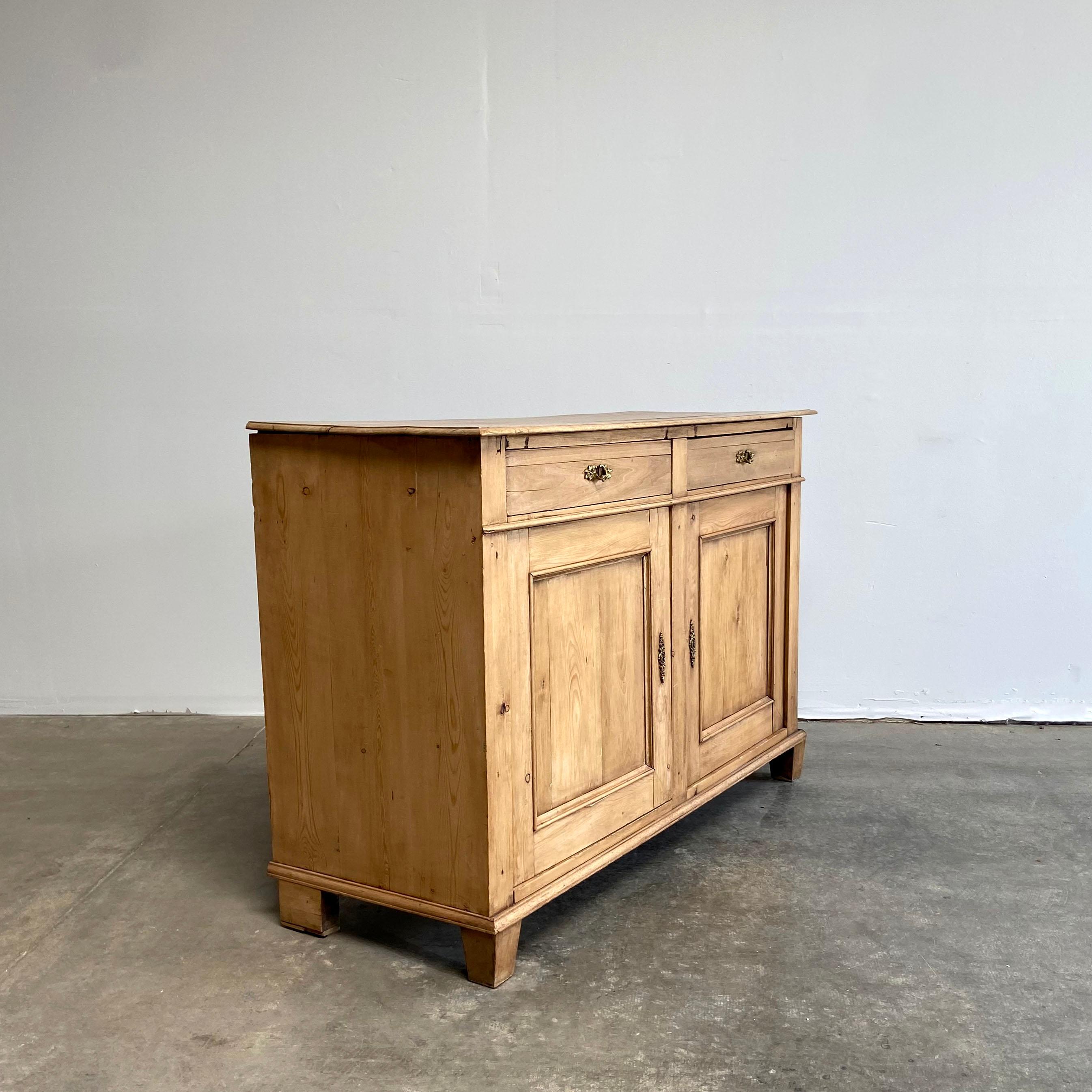 20th Century European Pine Sideboard or Cabinet. The doors open with ease, and have the original brass hardware. Sturdy, and ready for everyday use.

55”W x 21”D x 37”H
      