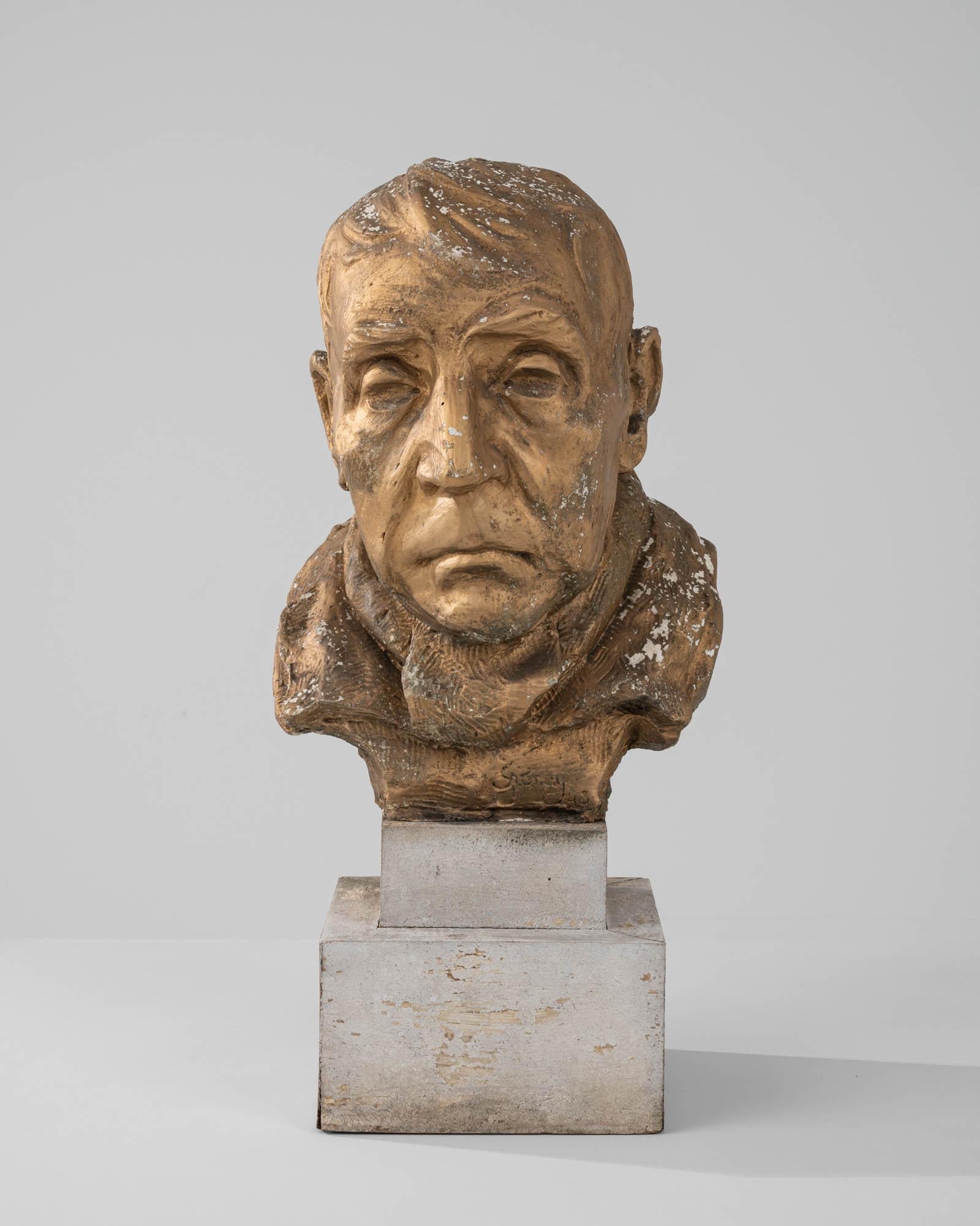 Sculpted in 20th-century Europe, this plaster bust portrays a senior man with meticulously crafted facial features—the arch of his bushy eyebrows, the downturned corners of his mouth, and deep wrinkles that trace the contours of his face—all