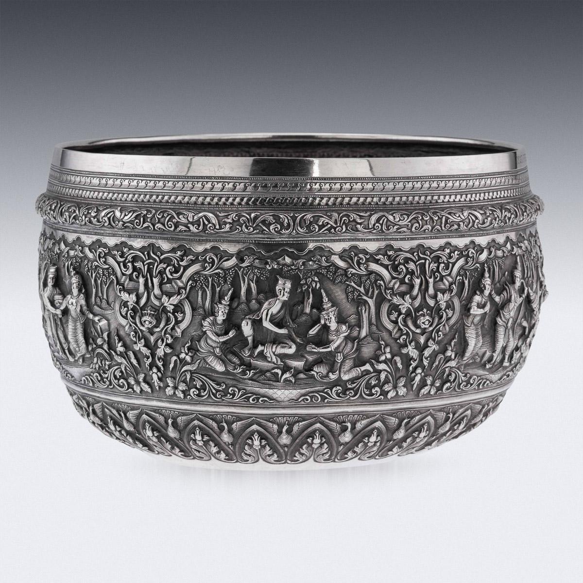 Antique early-20th century Burmese (Myanmar) exceptional solid silver repousse' bowl, decorated in high relief depicting six different traditional scenes from the Burmese mythology, showing very detailed figures set against a chiseled matted