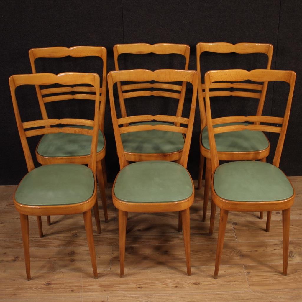 Six Italian chairs from the 1970s. Design furniture carved in exotic wood with seats covered in faux leather. A chair has the lack of supports in the padding (see photo) to be overhauled for perfect comfort. Seat height of 47 cm. Living room