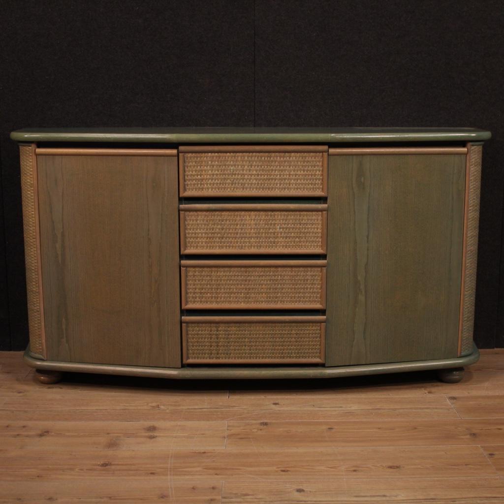 Italian design sideboard from the 1980s. Exotic wood furniture adorned with woven wood on the doors of beautiful line and good utility. Sideboard with two side doors and four central drawers of excellent capacity. Beautifully proportioned furniture