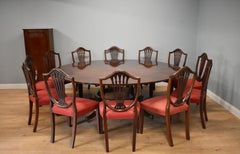 20th Century Extending Circular "Jupe" Style Dining Table and 12 Chairs