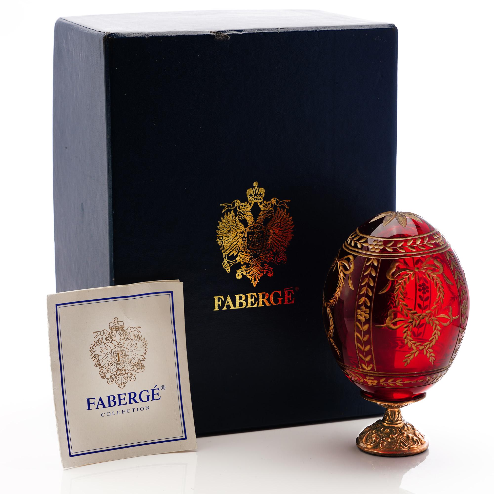 20th Century Faberge’ red blown crystal Imperial Egg ' Grand Dutchess ' , mounted on gold-plated bronze Stand.
Made in Russia, St. Petersburg, Ca.1990's 

Faberge’ imperial egg, has been engraved, signed and numbered by the artist.
Serial number