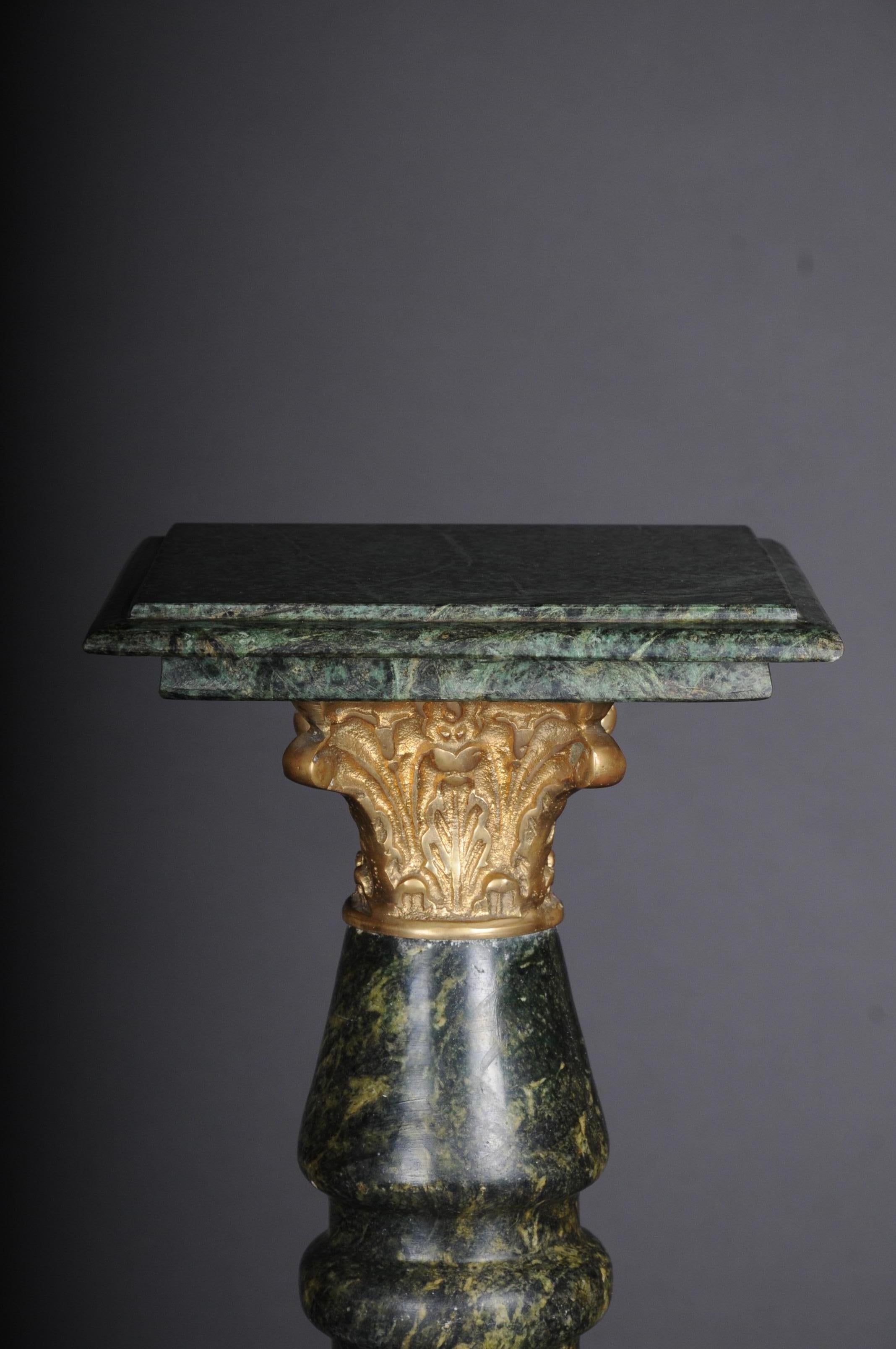 20th century Fancy marble column green with brass

Fancy marble column green with brass
Pedestal-shaped substructure, stepped and profiled. Column shaft turned. Unusual and decorative shape. Brass applications. Square profiled
