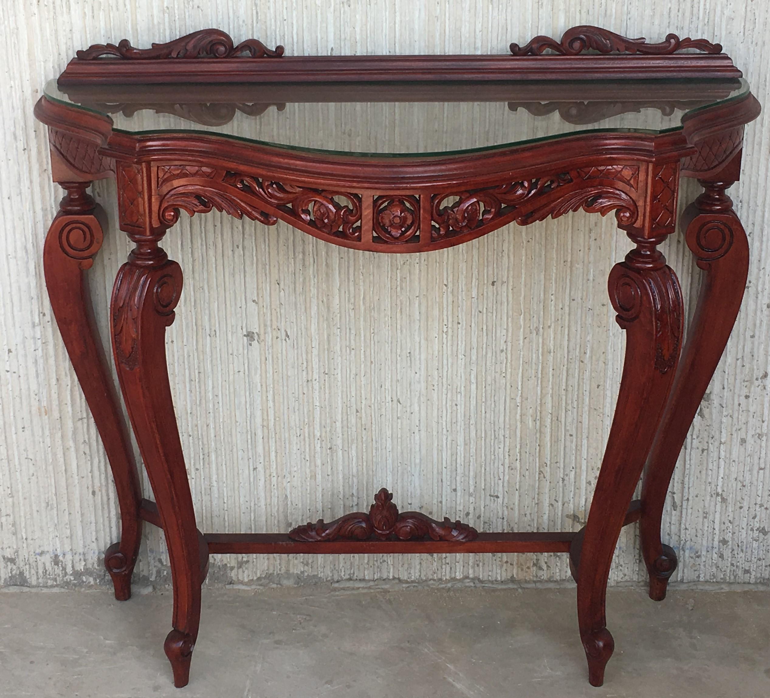 20th century fancy Rococo style Italian carved mahogany and glass and marquetry top console.