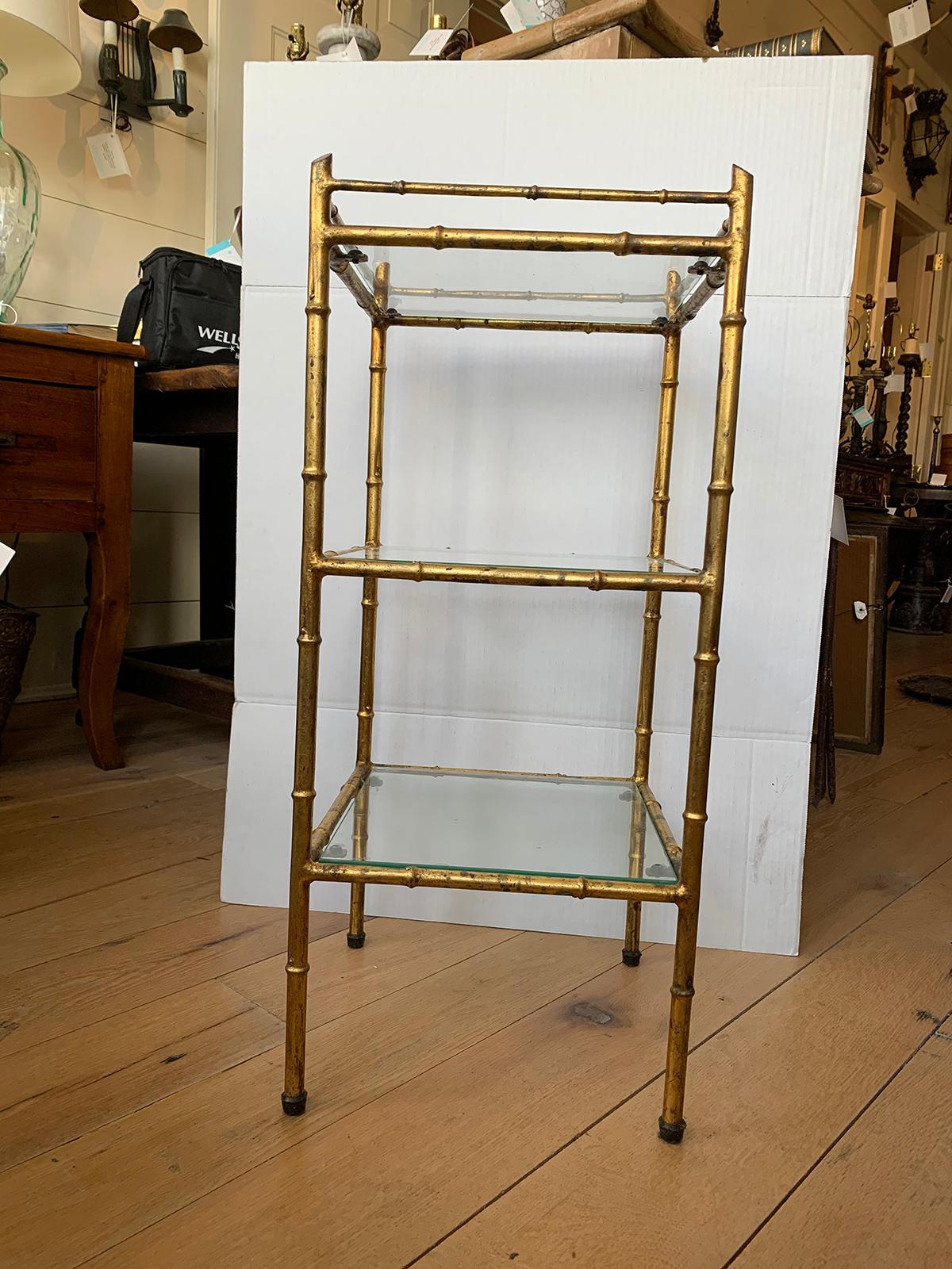 20th century faux bamboo gilt metal three-tier étagère with glass shelves
Perfect for a powder room / bathroom.