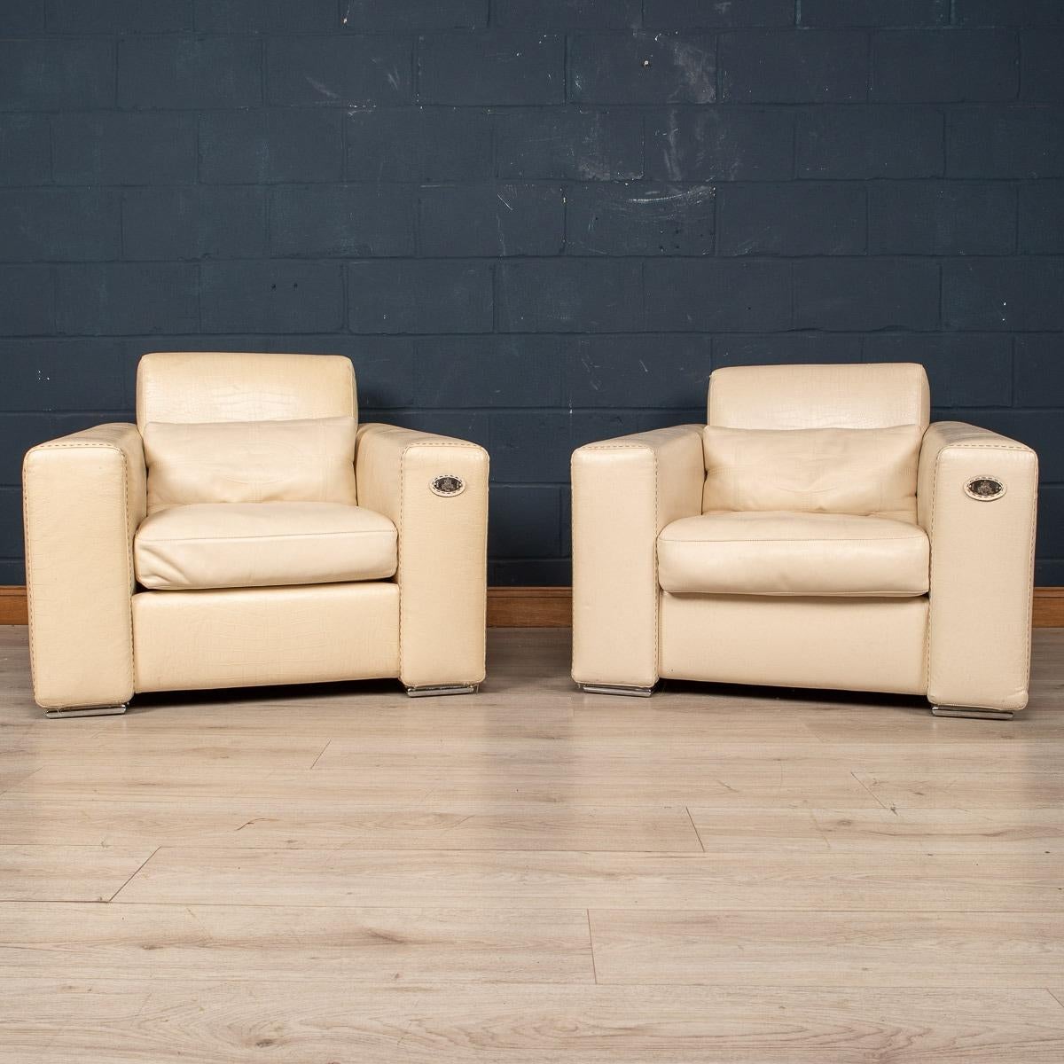A stunning pair of armchairs made in Italy by Fendi. Dating to the latter part of the 20th century, the supple white leather upholstery has a faux crocodile pattern on the armrests and back rest, giving them an elegant and unusual look. The details