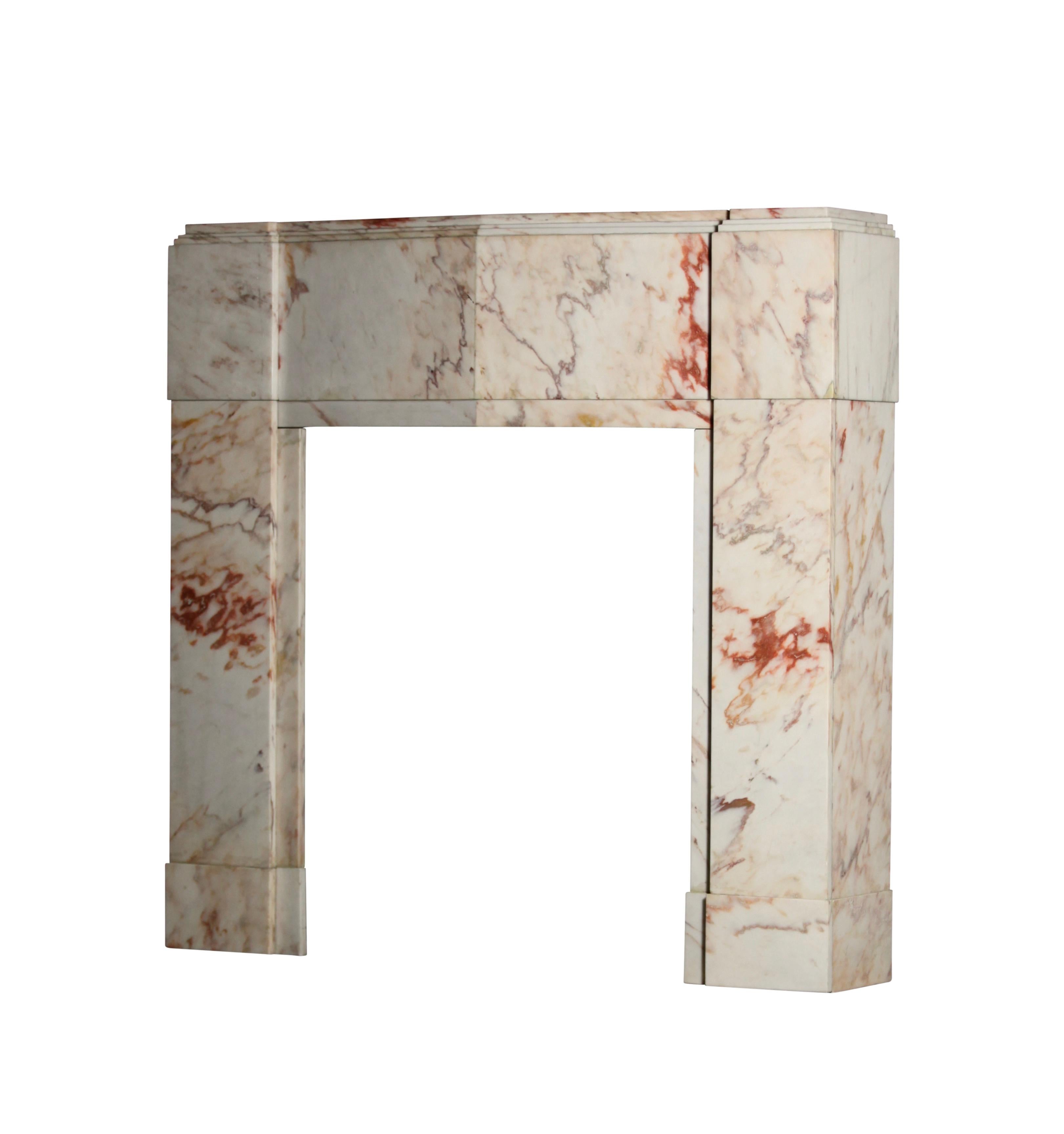 This fireplace surround is a perfect example of perfection and craftsmanship. The designer has respected the veining of the marble while still incorporating an Art Deco design. This mantel is completely original and not broken.
Original from an Art