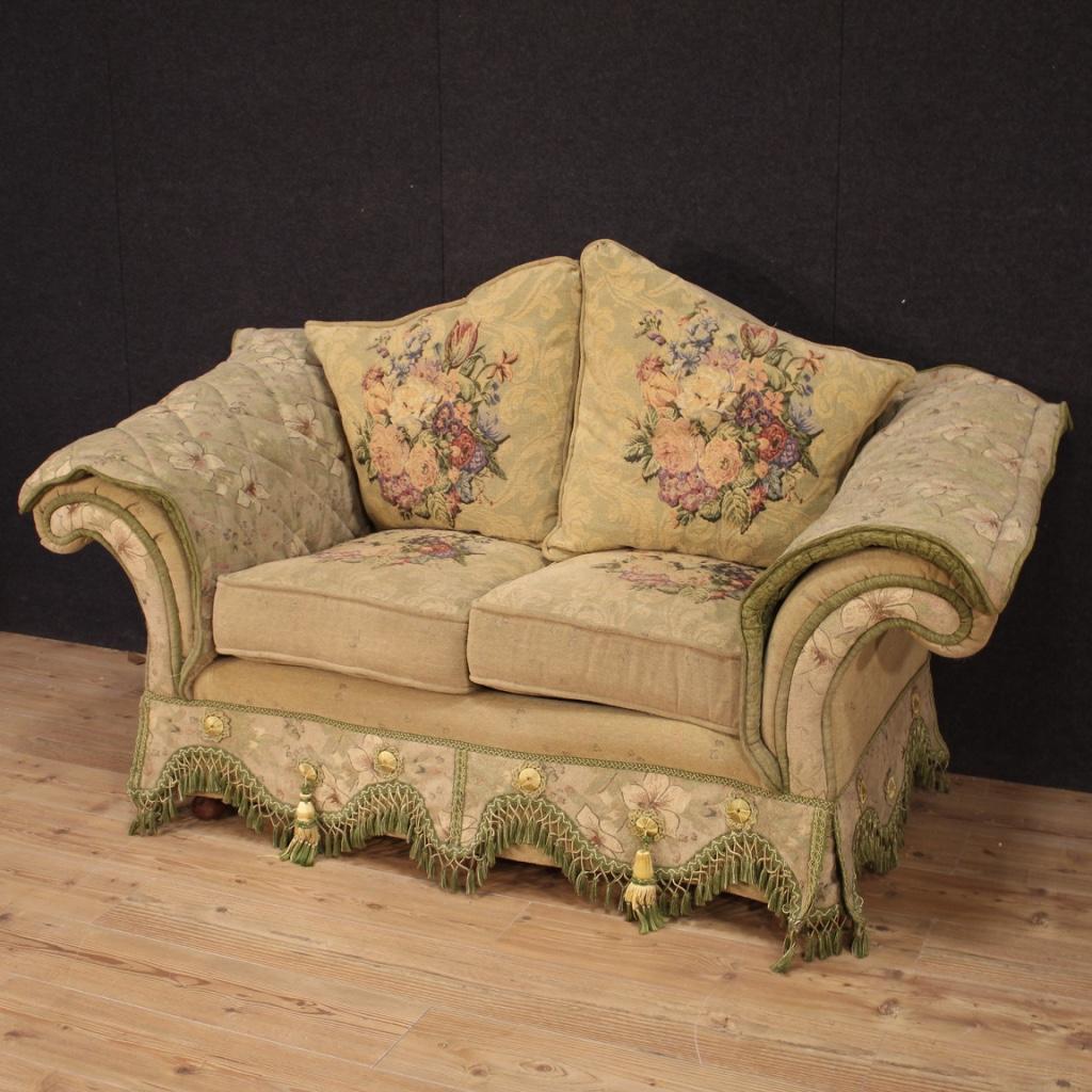 Mid-20th century French sofa. Furniture of exceptional quality completely covered in embroidered fabric and adorned with very pleasant floral decorations. Comfortable two-seat sofa with padding in good condition. Measure: Seat height of 61 cm.