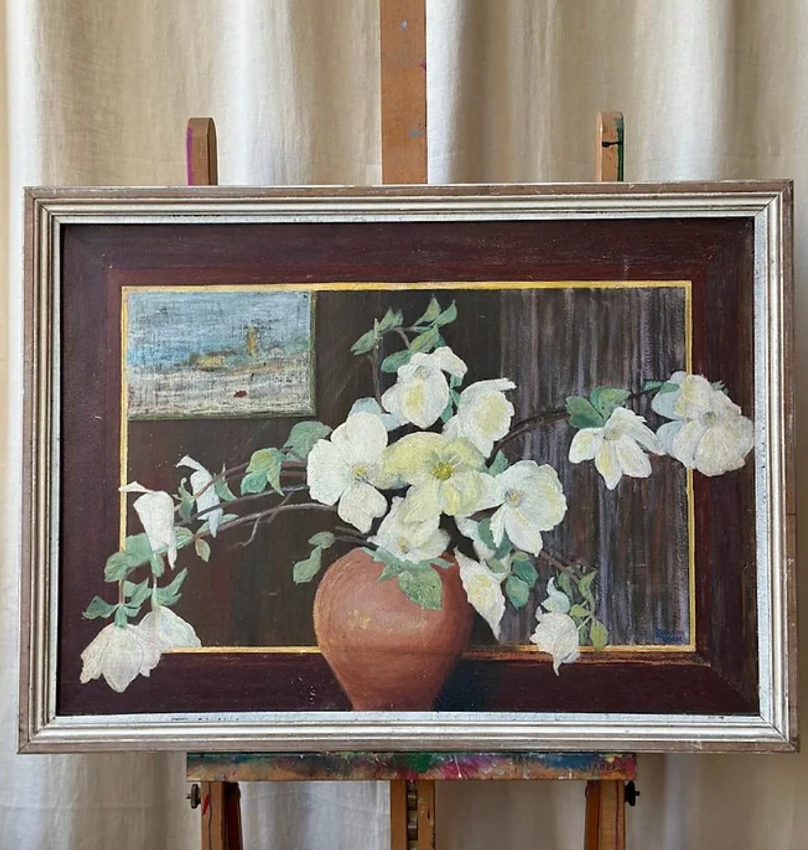 20th Century Floral Reflection Oil,

Spreading the height and width of this striking composition is a large mantle mirror, cleverly extenuating the real and reflective view of this elegant display of magnolia branches. Unsigned.

The painting has