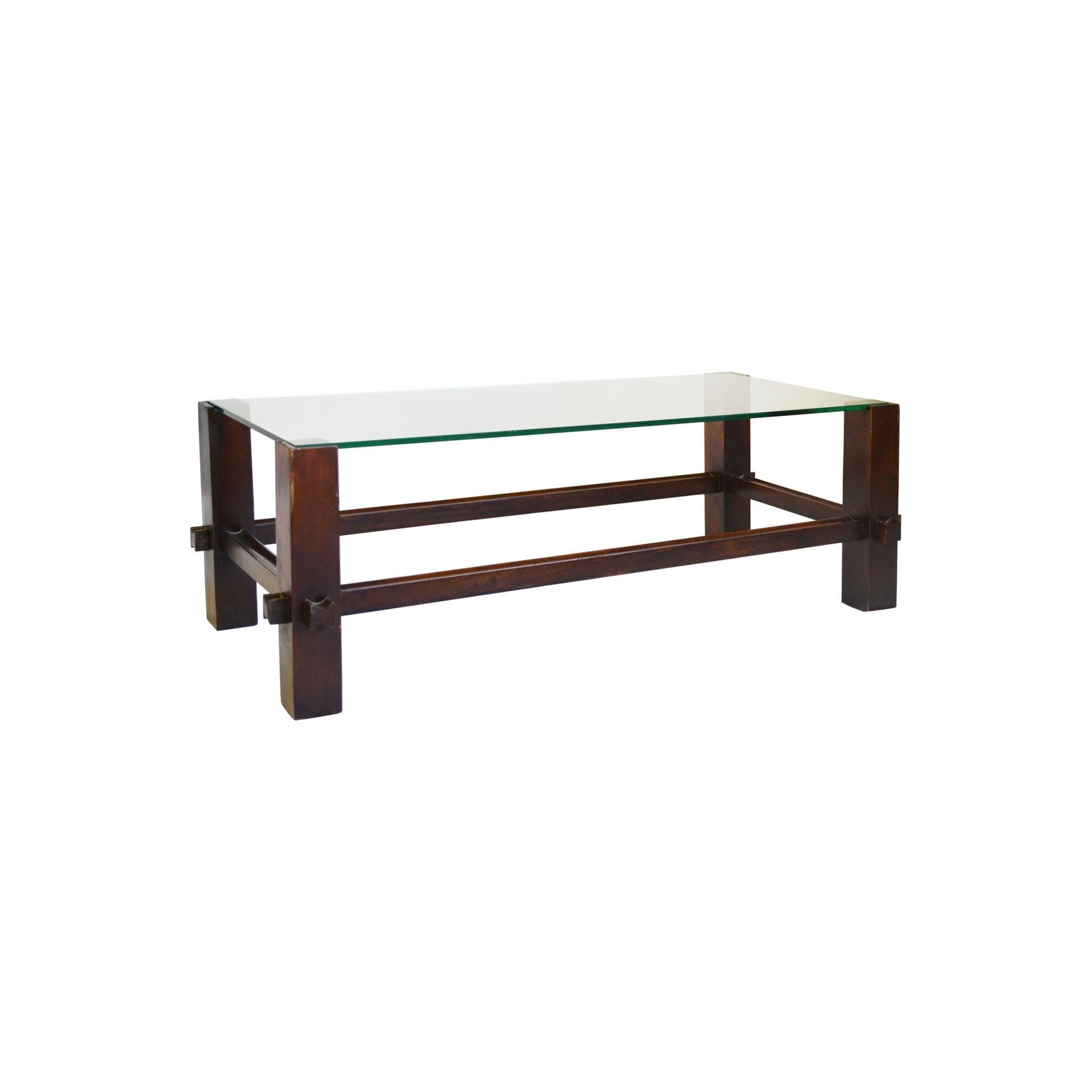 Low table or coffee table model number 2461 designed by Fontana Arte in 1960s. The table has a very modern and particular structure totally in wood, where the main theme is the celebration of the joint among parts in wood. The rectangular top is in
