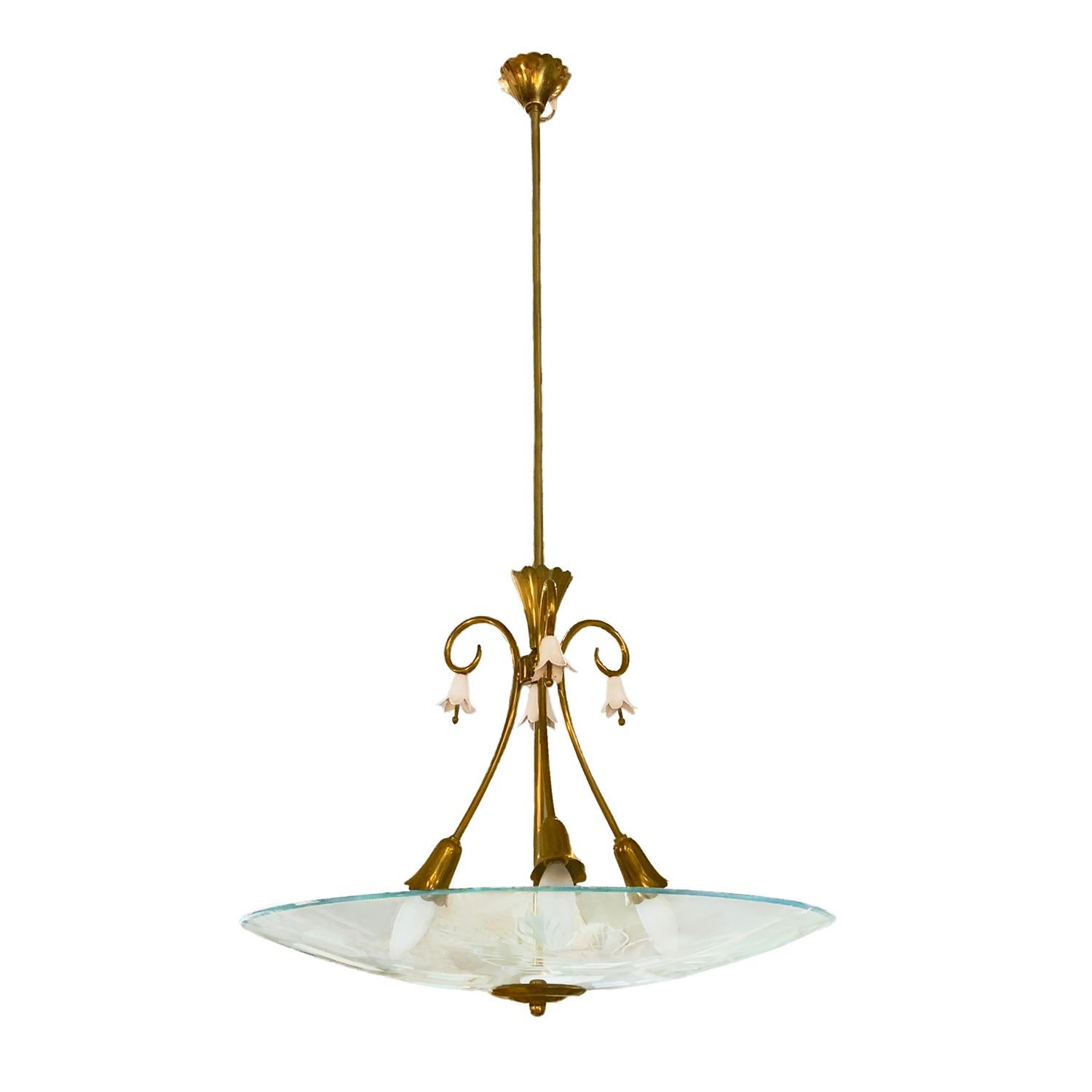 A vintage Mid-Century Modern Italian chandelier made of a brass structure and hand blown crystal glass, enhanced by partially etched details, featured with three light sockets. Designed by Pietro Chiesa and produced by FontanaArte in good condition.