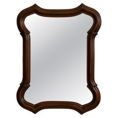 Specchio con bordi smerlati in legno intagliato, color noce scuro, Francia, XX secolo