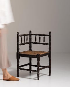 20th Century France Weathered Dark Oak Rush-Seated Spindle-Back Chair