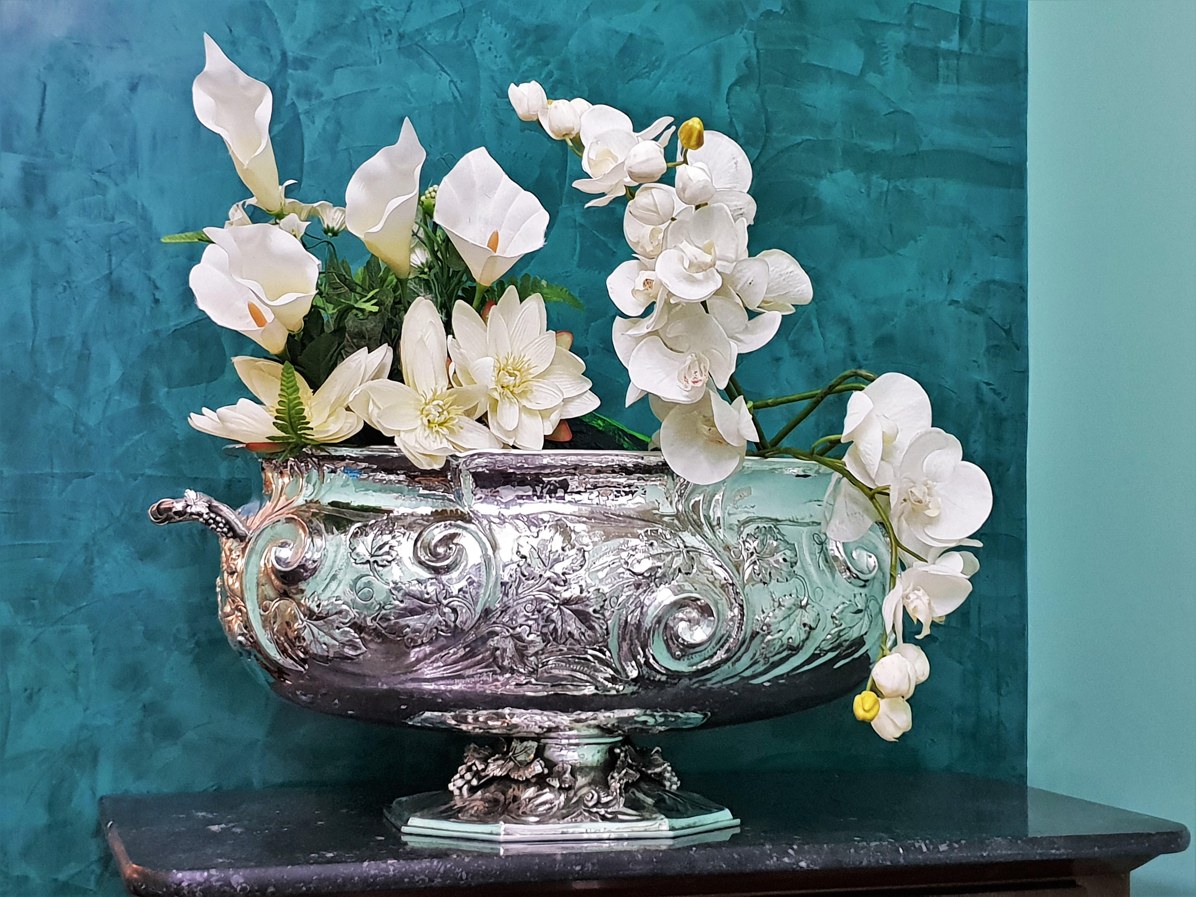 Magnificent handcrafted engraved silver centerpiece. 

Impressive dimensions and wonderful handwork.

Realized between 1934 and 1944 by Fratelli Ponzone from Alessandria, Italy.

Oval shaped, engraved in rococo style with vines leaves motif,