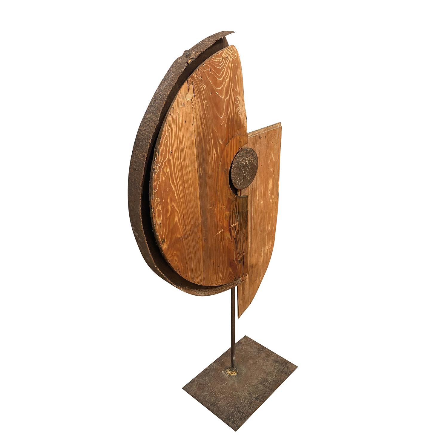An antique French Industrial abstract sculptural made of hand crafted Metal and Walnut in the Style of Sonia Delaunay, in good condition. The detailed décor piece is particularized with geometrical shapes. Minor fading, due to age. Wear consistent