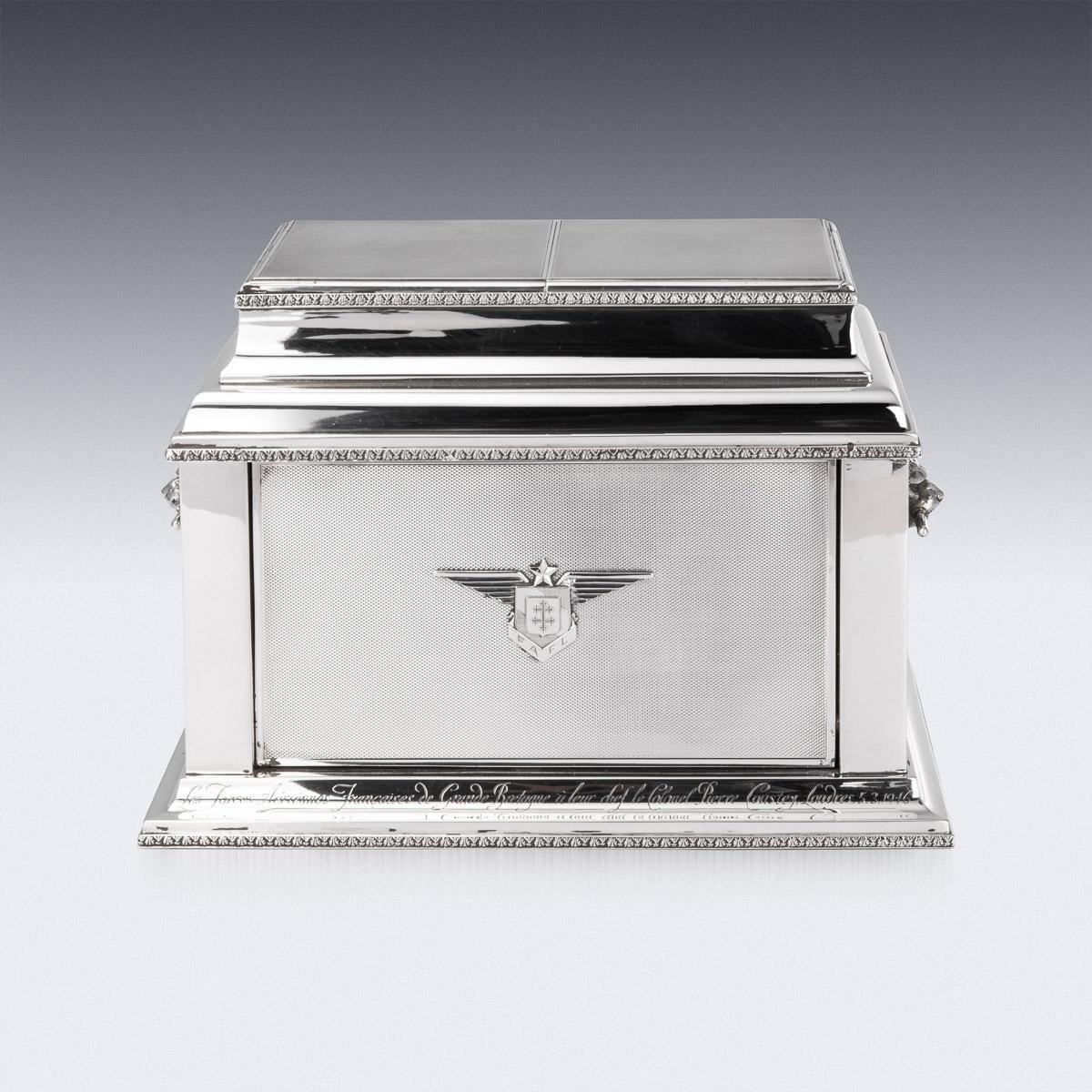 Superb early-20th Century Art Deco solid silver stylish mechanised cigar and cigarette humidor box, sarcophagus-shaped, engine turned and applied with a fine acanthus leaf boarders, sides mounted with realistically modelled lion masks with bars in
