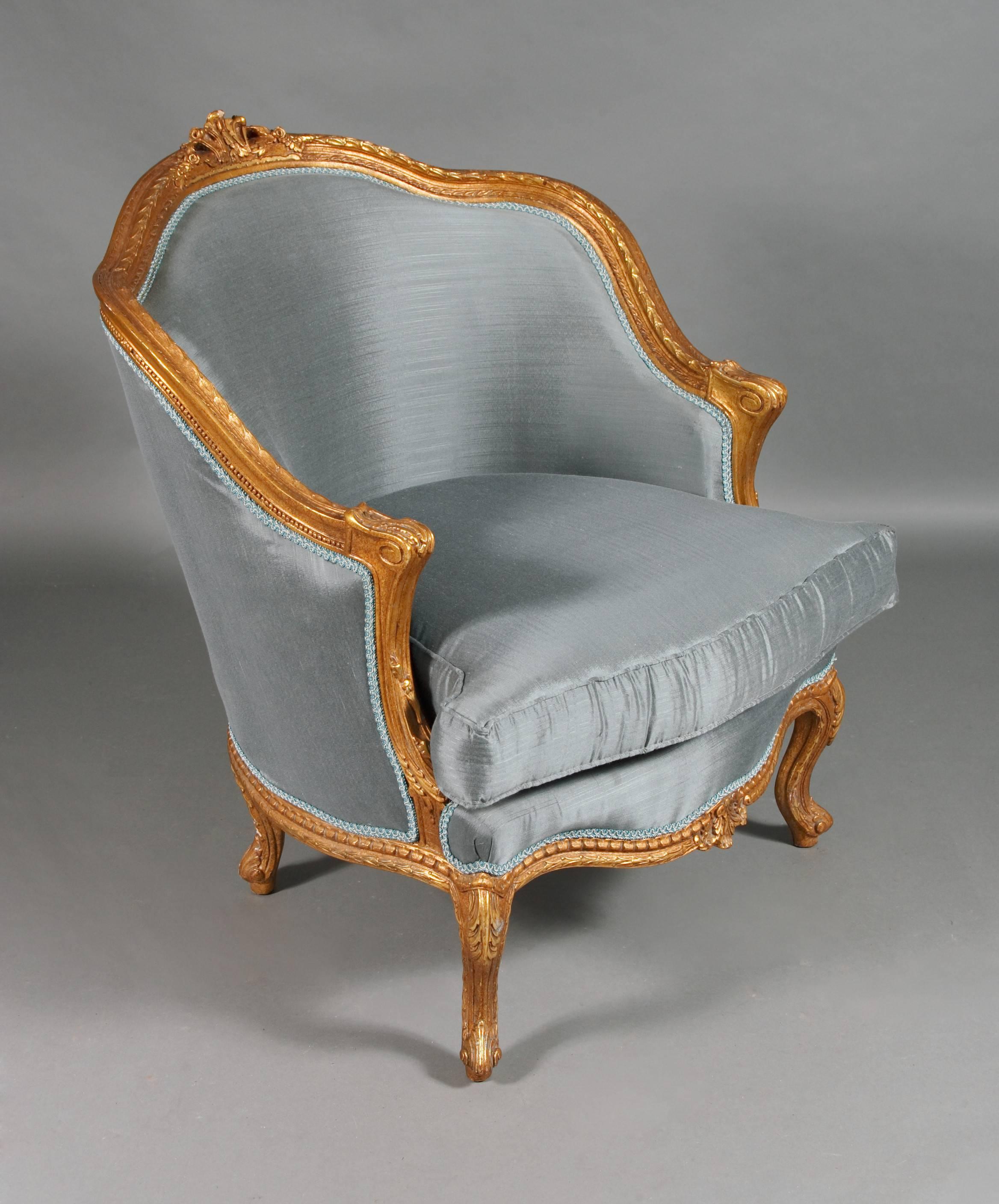 Solid beechwood, carved, colored and gilded. Semi-circular ascending backrest frame with rocaille crowning. Passive, carved frame. Slightly bent frame on curly legs. The seat and backrest are finished with a Classic upholstery. The fabric cover is