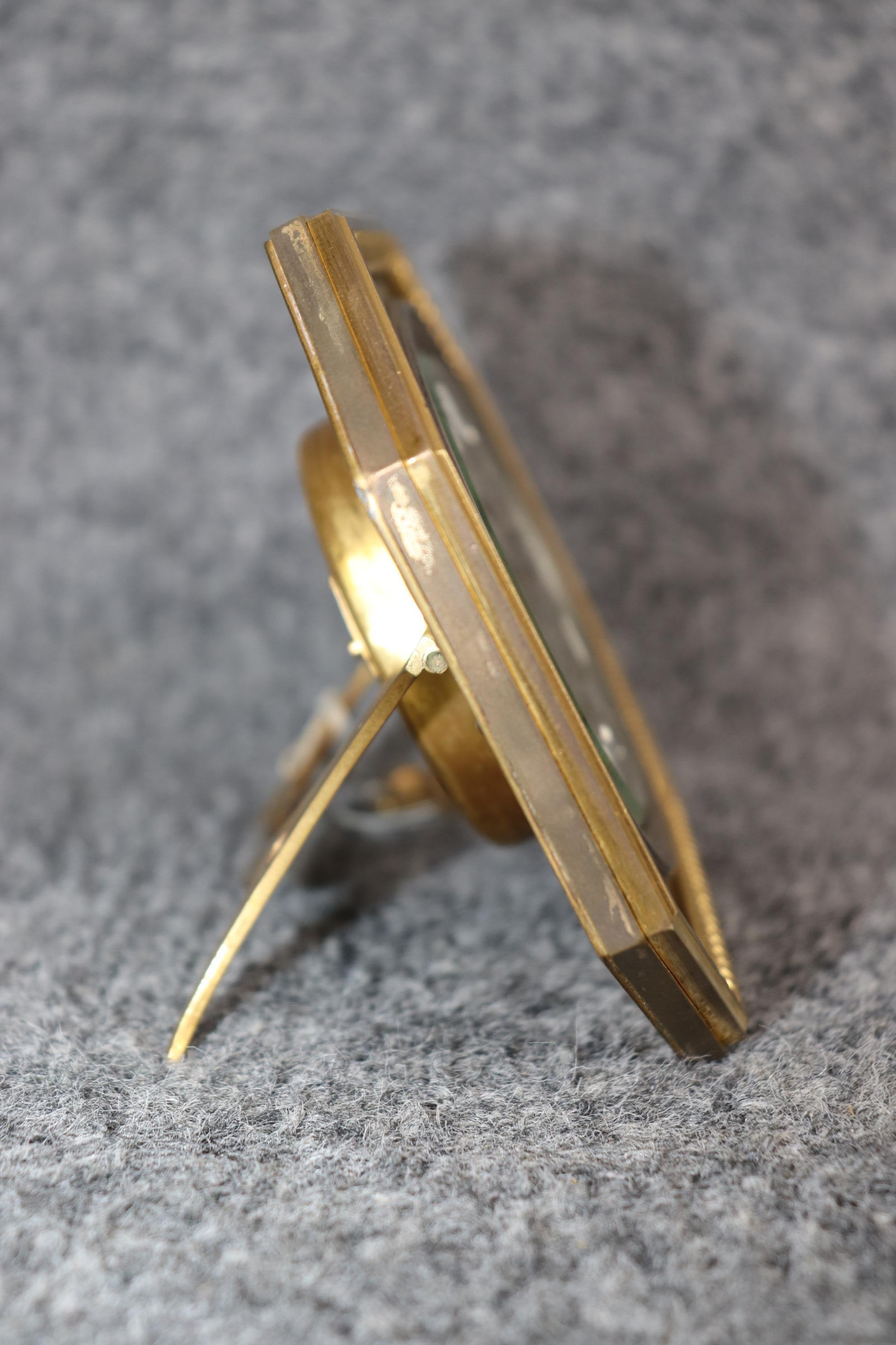 Dimensions: Height: 4 1/4 in Width: 5 1/2 in Depth: 2 1/2 in

This antique early 20th century French Art Deco bronze ormolu desk clock is made of the highest quality and perfect for you and your home! This will be perfect for your any office,