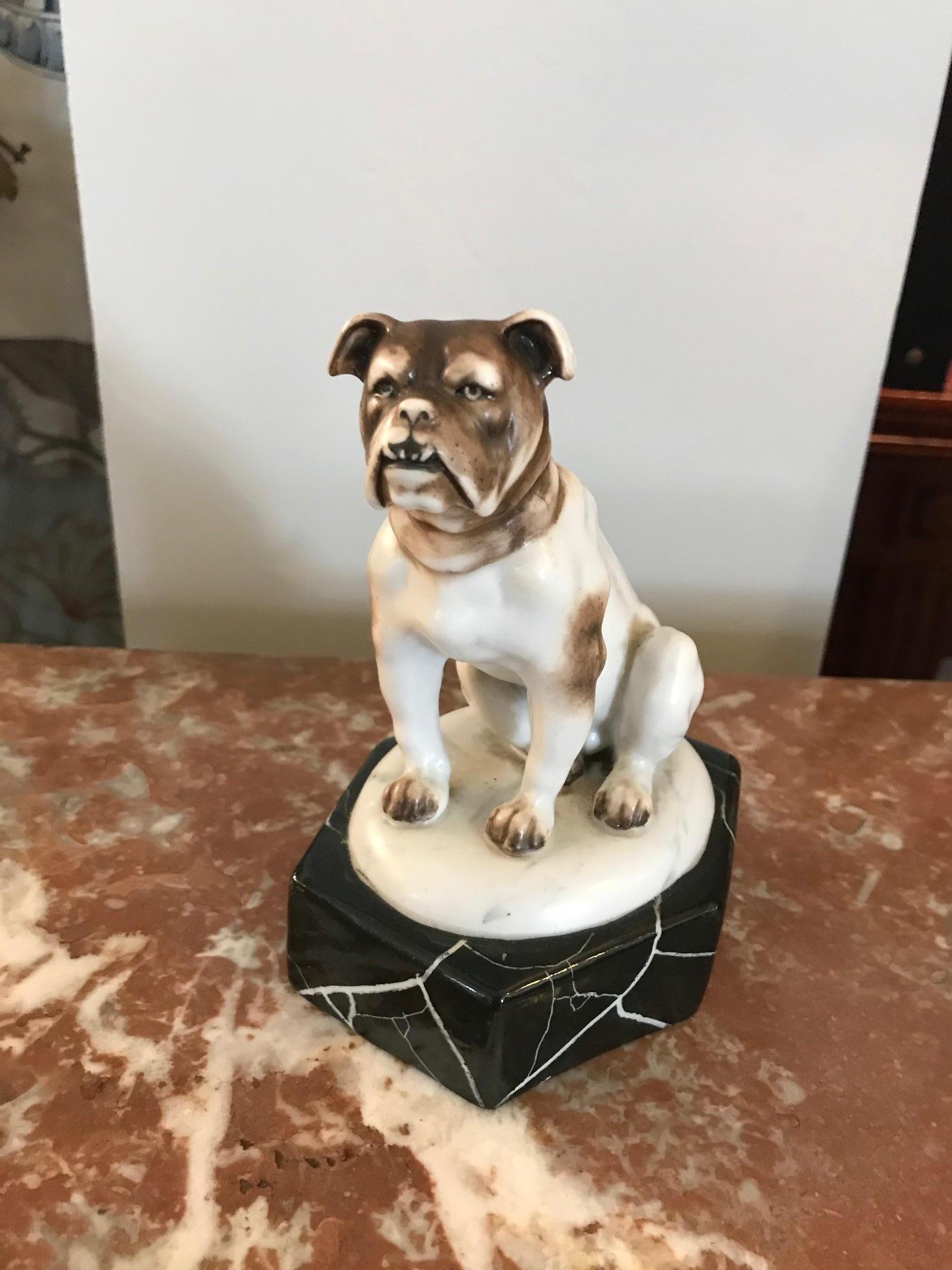 Very nice 20th century French Art Deco Porcelain Bulldog from the 1930s. 
Porcelain base marble imitation. 
Good condition.