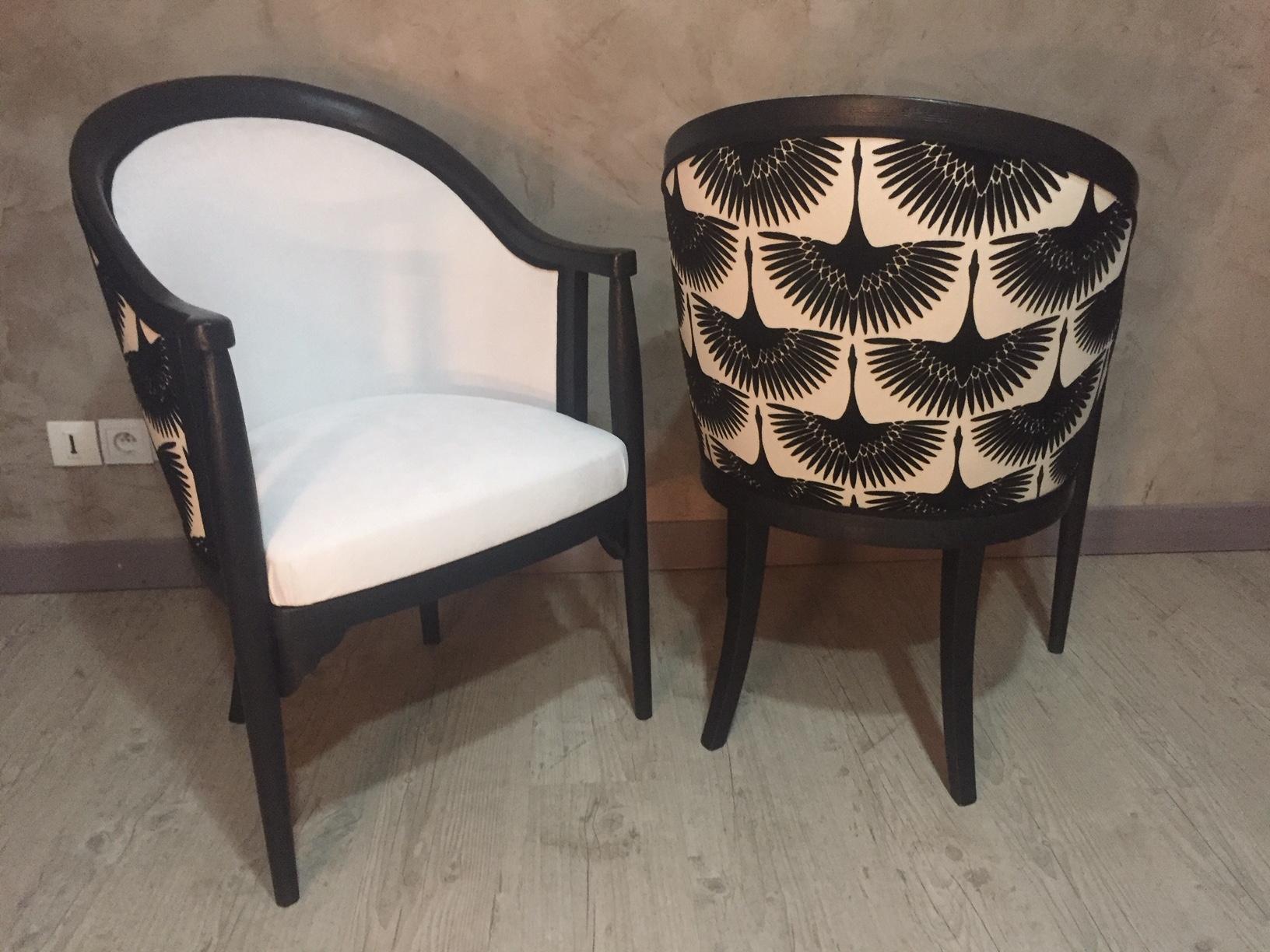 Exceptional 20th century French Art Deco entirely upholstered Armchair pair from the 1930s. The wood has been pickled and painted in black.
At the back, there is a beautiful fabric with black storks and the seating is a aquaclean white fabric. It