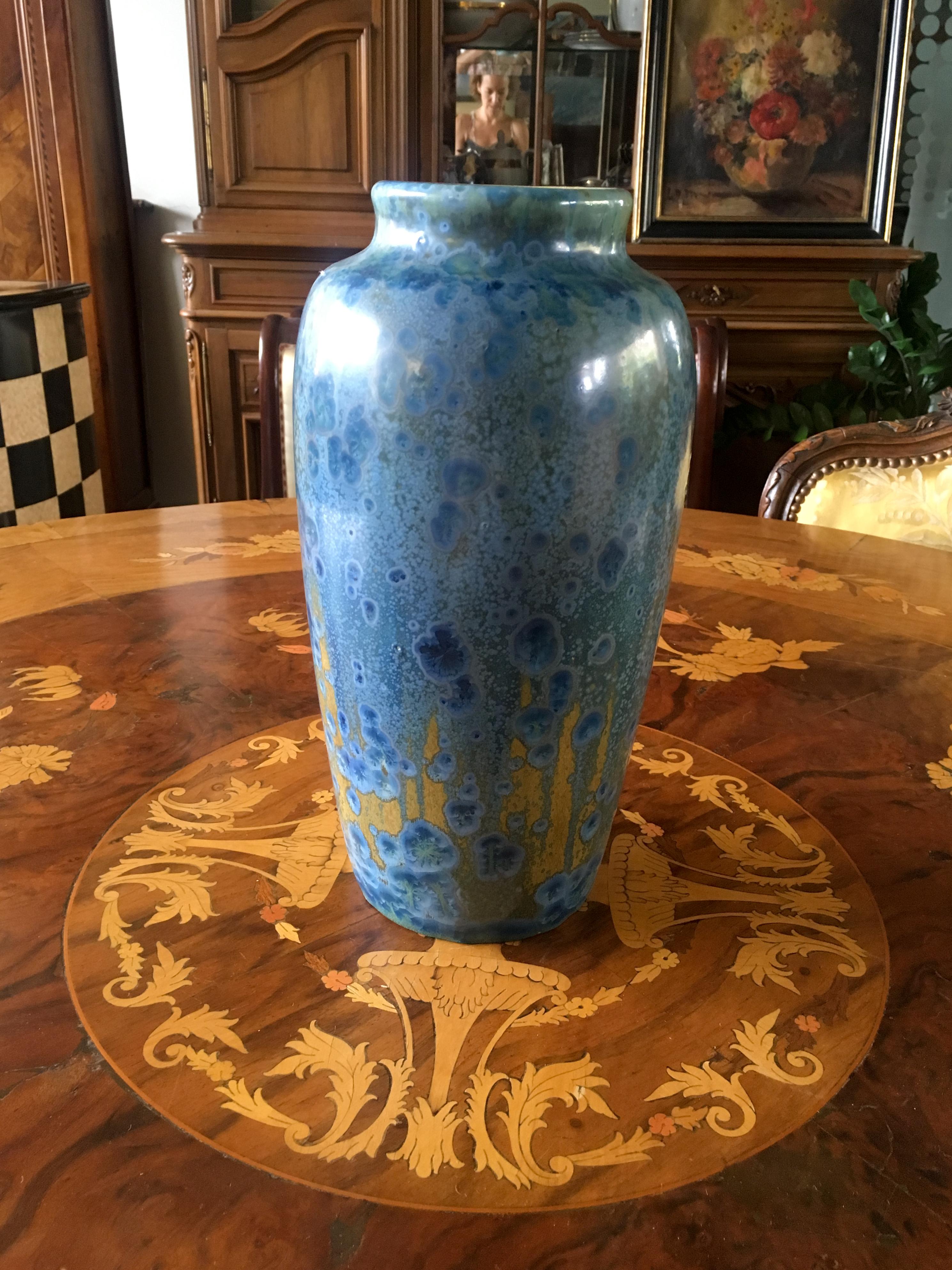 A Pierrefonds pottery vase in tones of blue, tan and brown, partially decorated in crystalline glazes, stamped factory marks.
France, circa 1900.