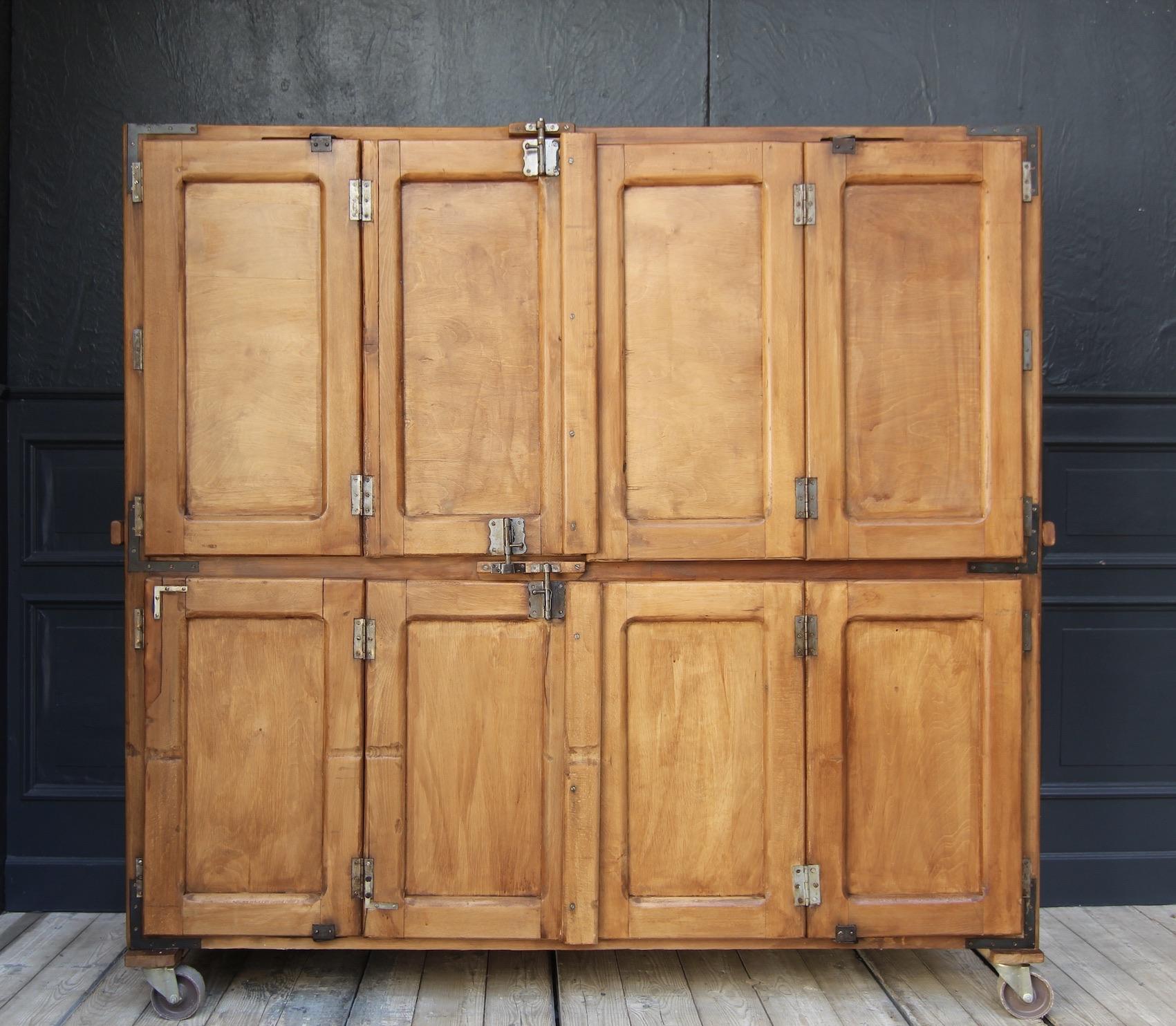 French bakery cabinet from the 1st half of the 20th century.

Beech wood corpus on castors with 4 folding doors, behind which there are 9 removable shelves.

Dimensions:
175 cm high / 68.9 inch High,
184 cm wide / 72.4 inch Wide,
60 cm deep /