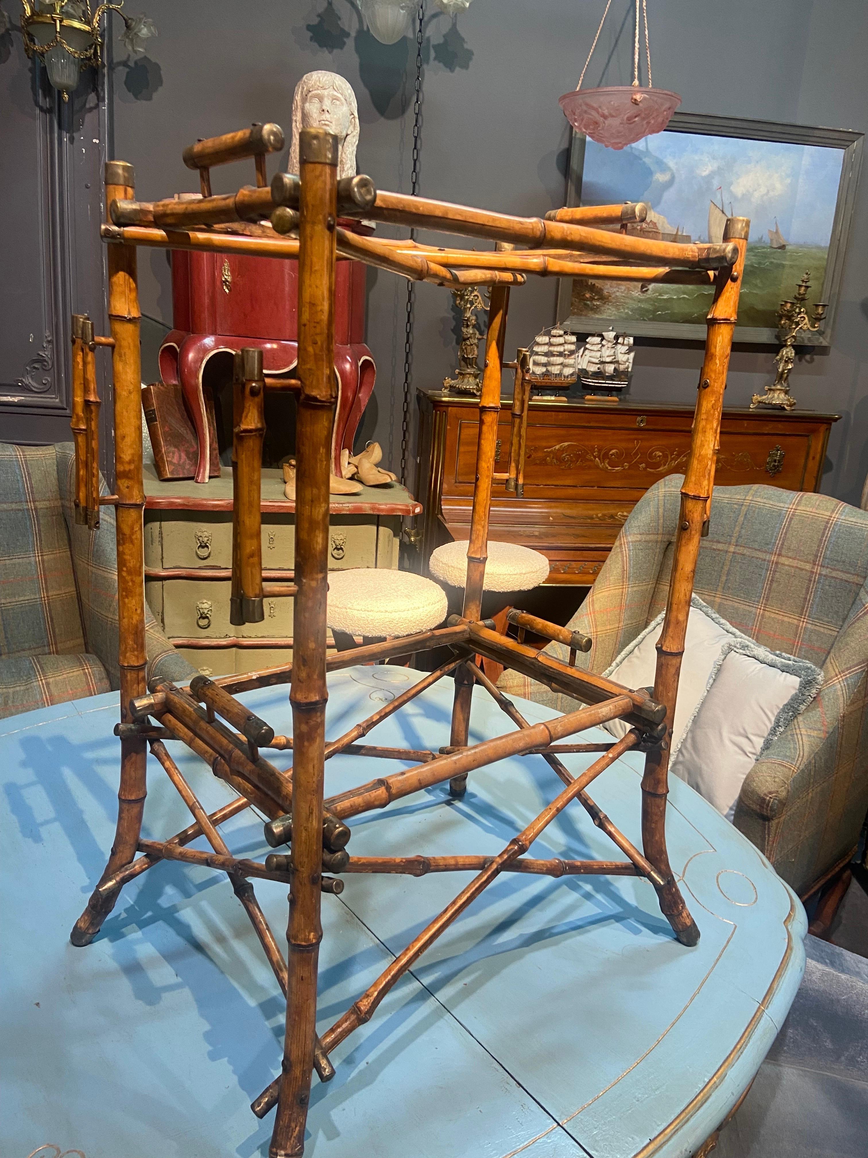 20th century bamboo serving bar cart trolley with two removable levels in quite good condition made in France circa 1920. There are small brass caps at the end of each element. The original tops are missing but could be replaced with glass or