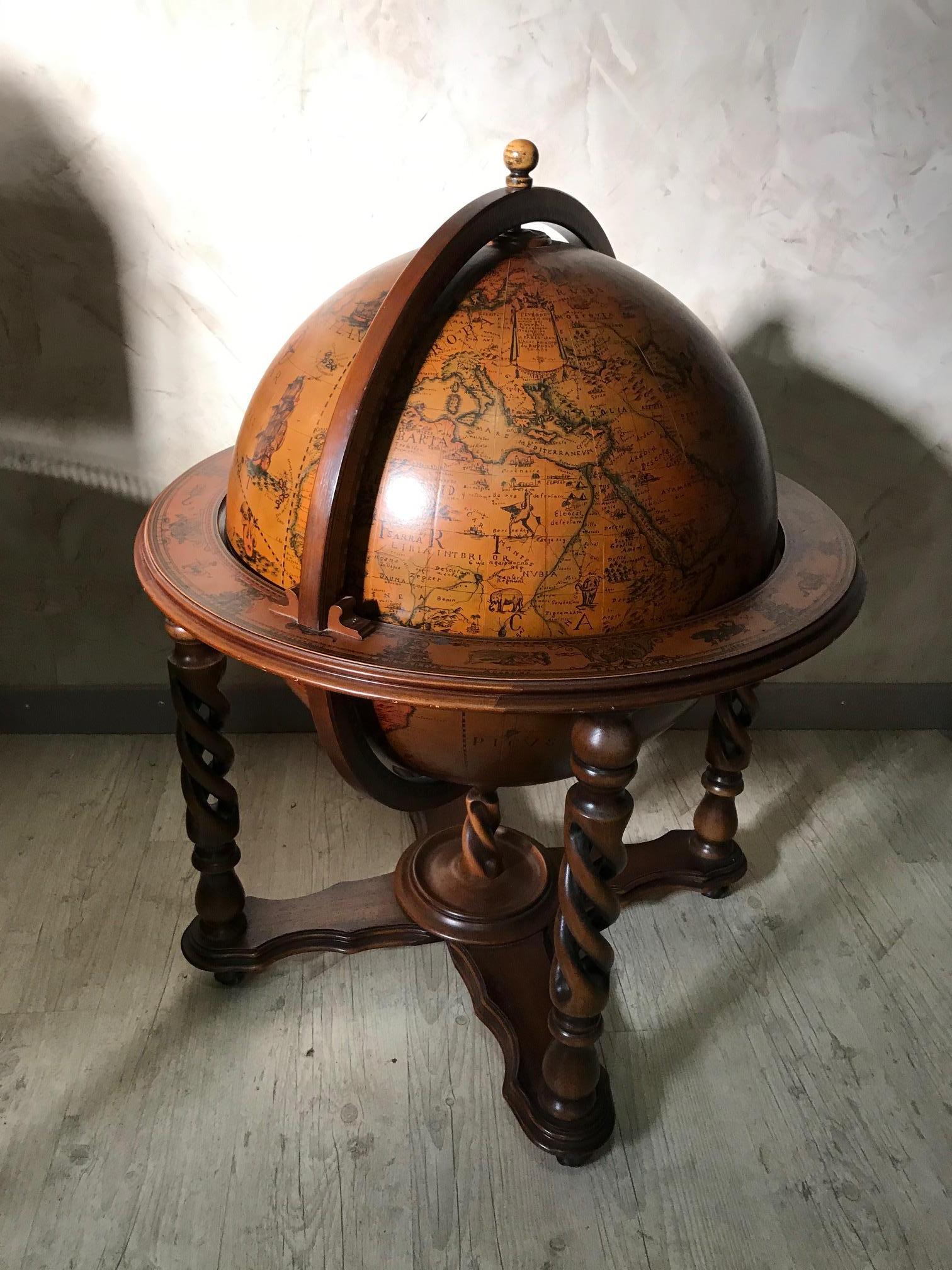 Very nice and original 20th century French rolling bar world globe from the 1940s.
Wooden structure covered by a paper world map. Opening top to store bottles.
The inside is covered with different animal and character from the mythology.
On the