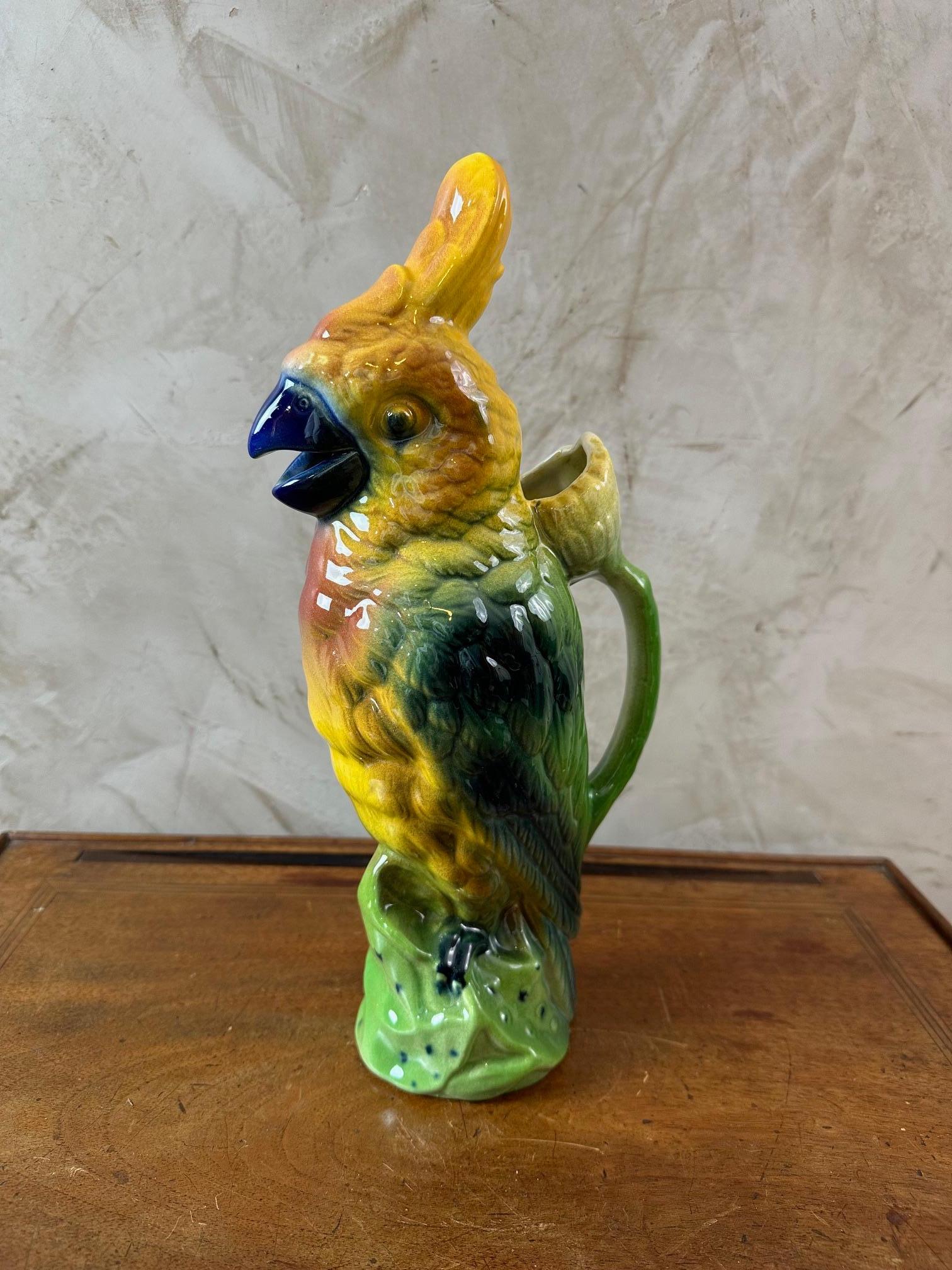 Very nice 20th century French Majolica Parrot made by the famous Saint Clément manufacture. Beautiful Hand painted work with vibrant coloration and glaze. Numbered 748 and stamped 