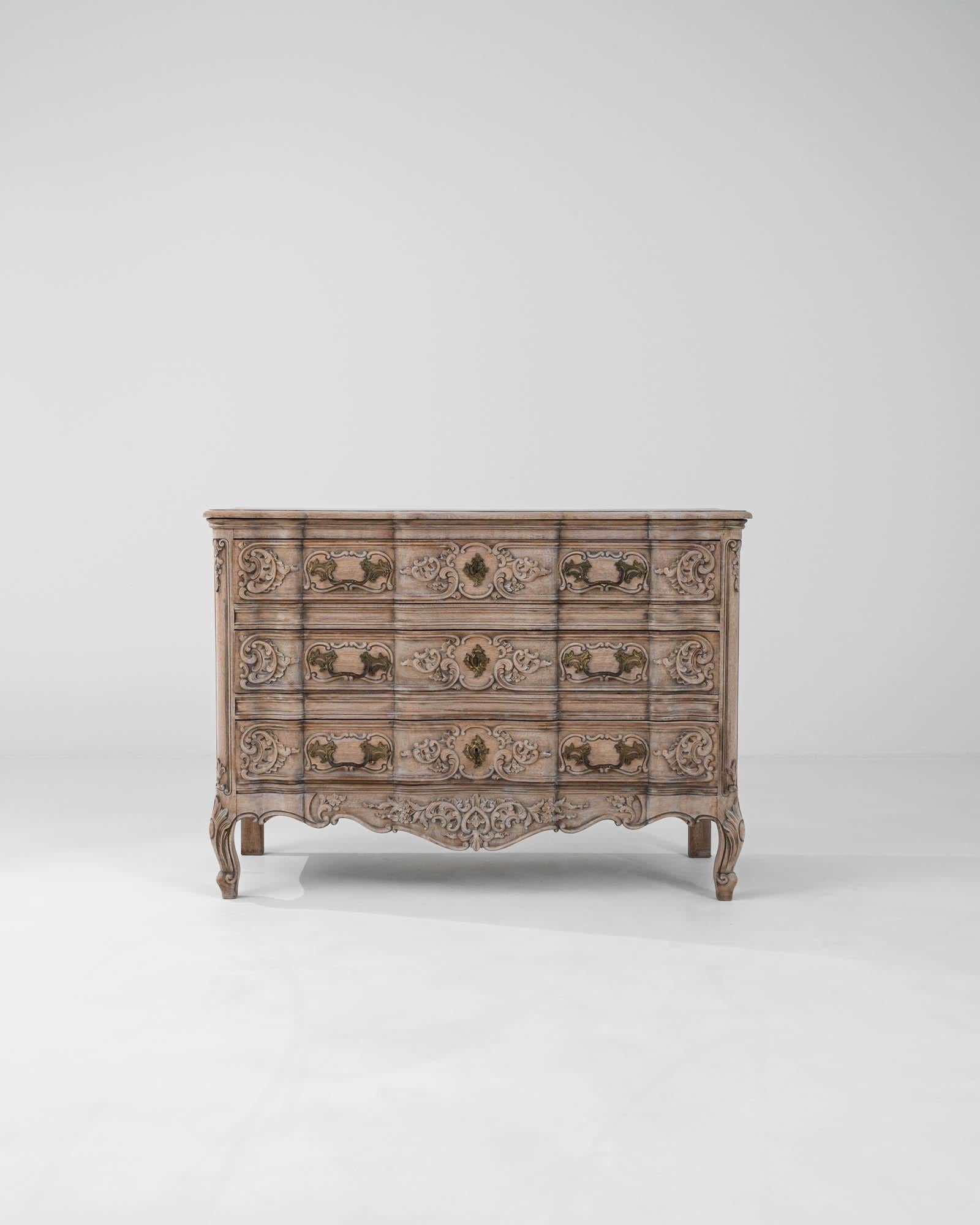 Experience the timeless beauty and meticulous craftsmanship of this 20th Century French bleached oak chest of drawers. Designed to bring a refined elegance to your bedroom or living space, this exquisite piece features a stunning bleached oak finish