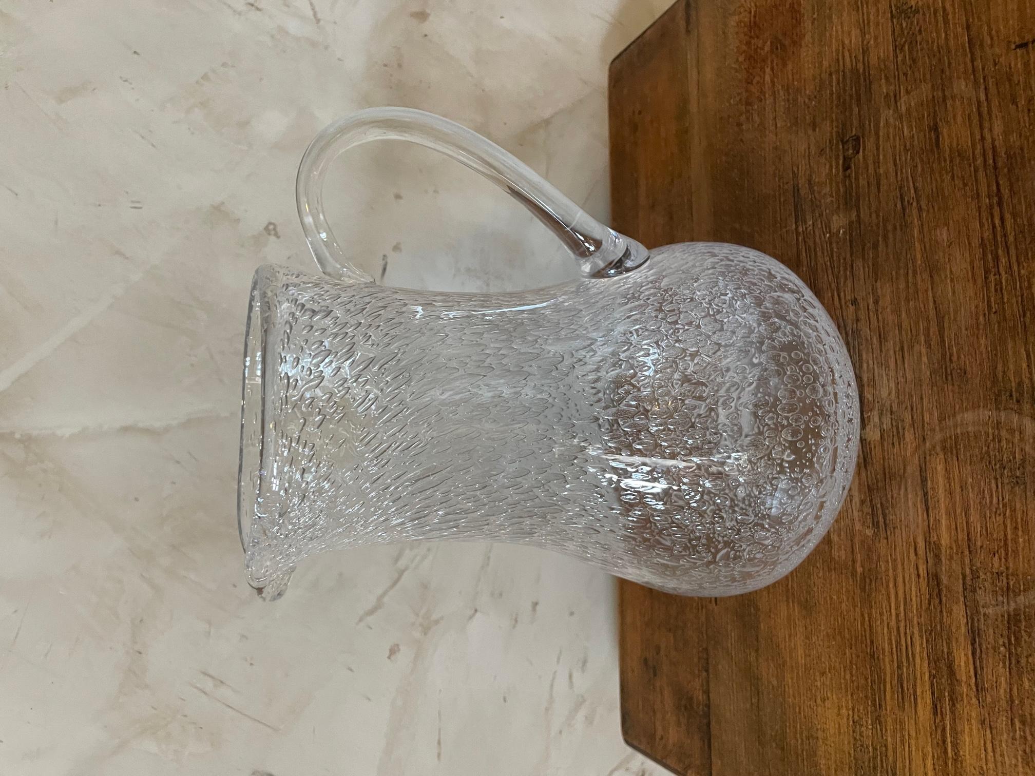 Beautiful transparent blown glass pitcher made by BIOT in the 1940s. 
Very practical large handle. Very nice quality.