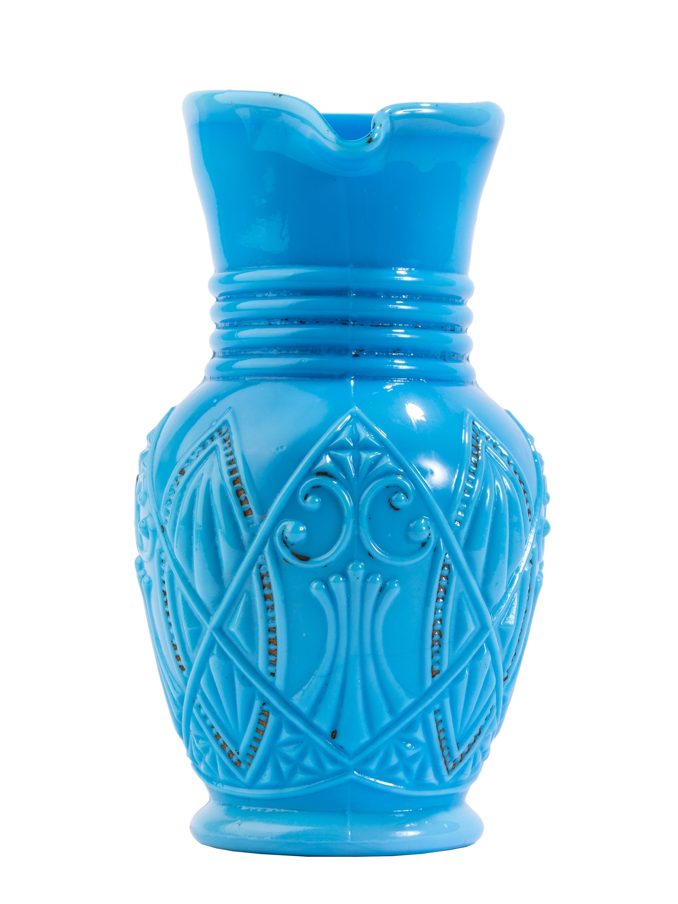 Probably produced by French glassmaker Portieux Vallerysthal in the early 20th century. Though not true hand blown French opaline glass, P/V called its many series of milk glass style opaque turquoise-blue pieces 