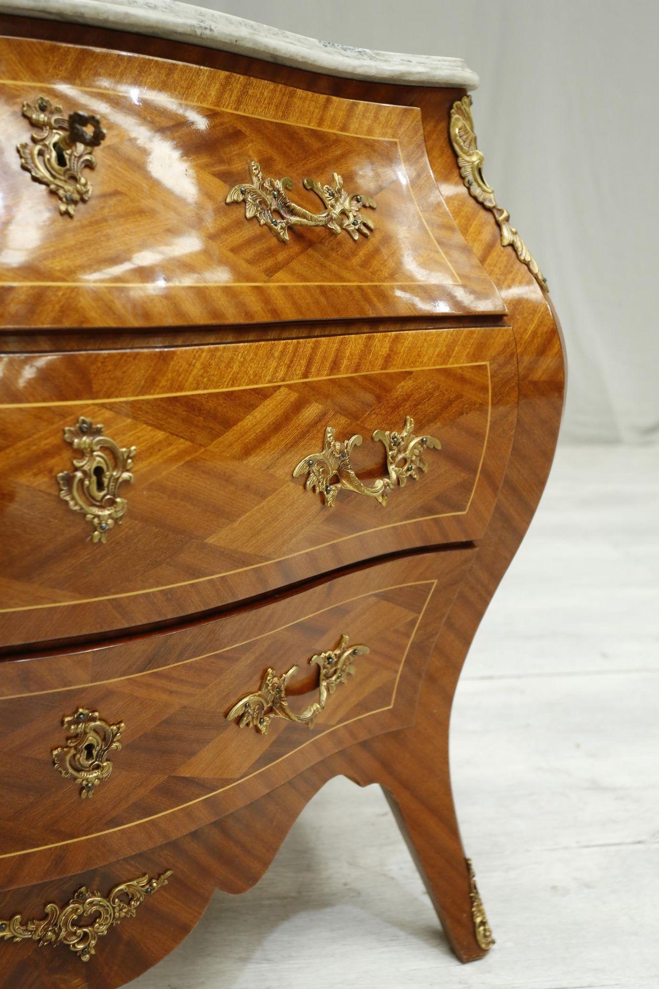 This is a stunning quality 20th century French bombe chest. The overall condition is superb with a very clean original finish the the body and the marble. The diamond details all over the piece give this a real style that would fit nicely in many