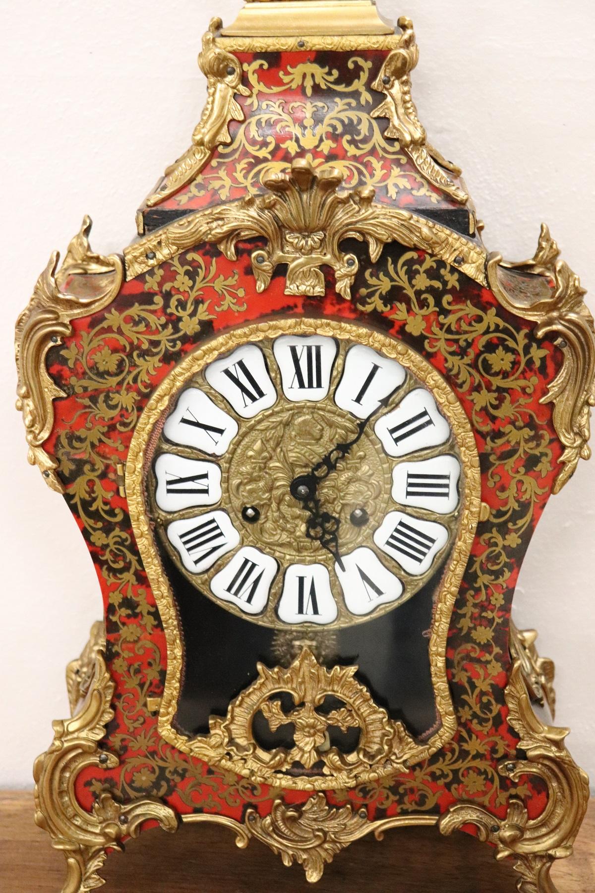Rare and fine quality French Louis XV style boulle circa 1920s red tortoiseshell and brass inlaid table clock. The clock has very good quality bronze gilt ormolu mounts. Perfect condition.