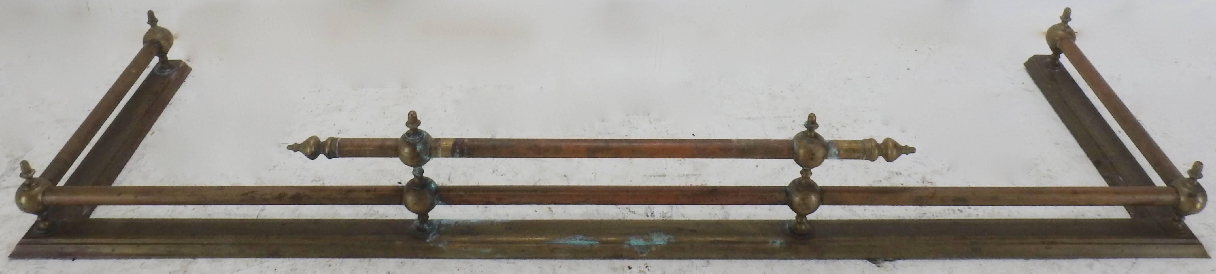 The aged patina on this Classic fireplace fender will give your cozy spot a new look! Brass spheres topped with finials give this piece a style that will never go away.