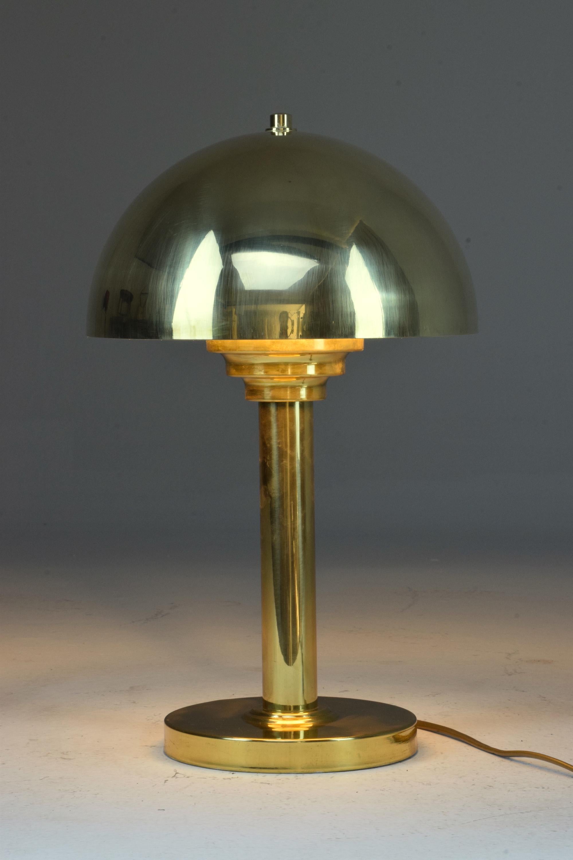 A French mushroom-shaped Art Deco style 20th century table or desk lamp in brass.

All our pieces are fully restored at our atelier and we only offer items that will last another lifetime. There may be light age-related wear but no hard damages or