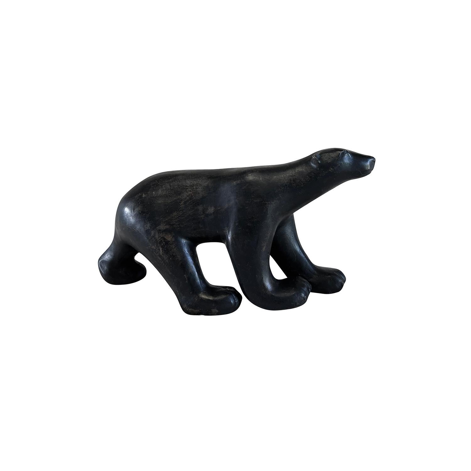 A vintage Art Deco Style French polar bear sculpture made of hand crafted patinated bronze, designed and produced by Pierre Chenet in good condition. The detailed décor piece is very similar to the bear from Francois Pompon which is located at the