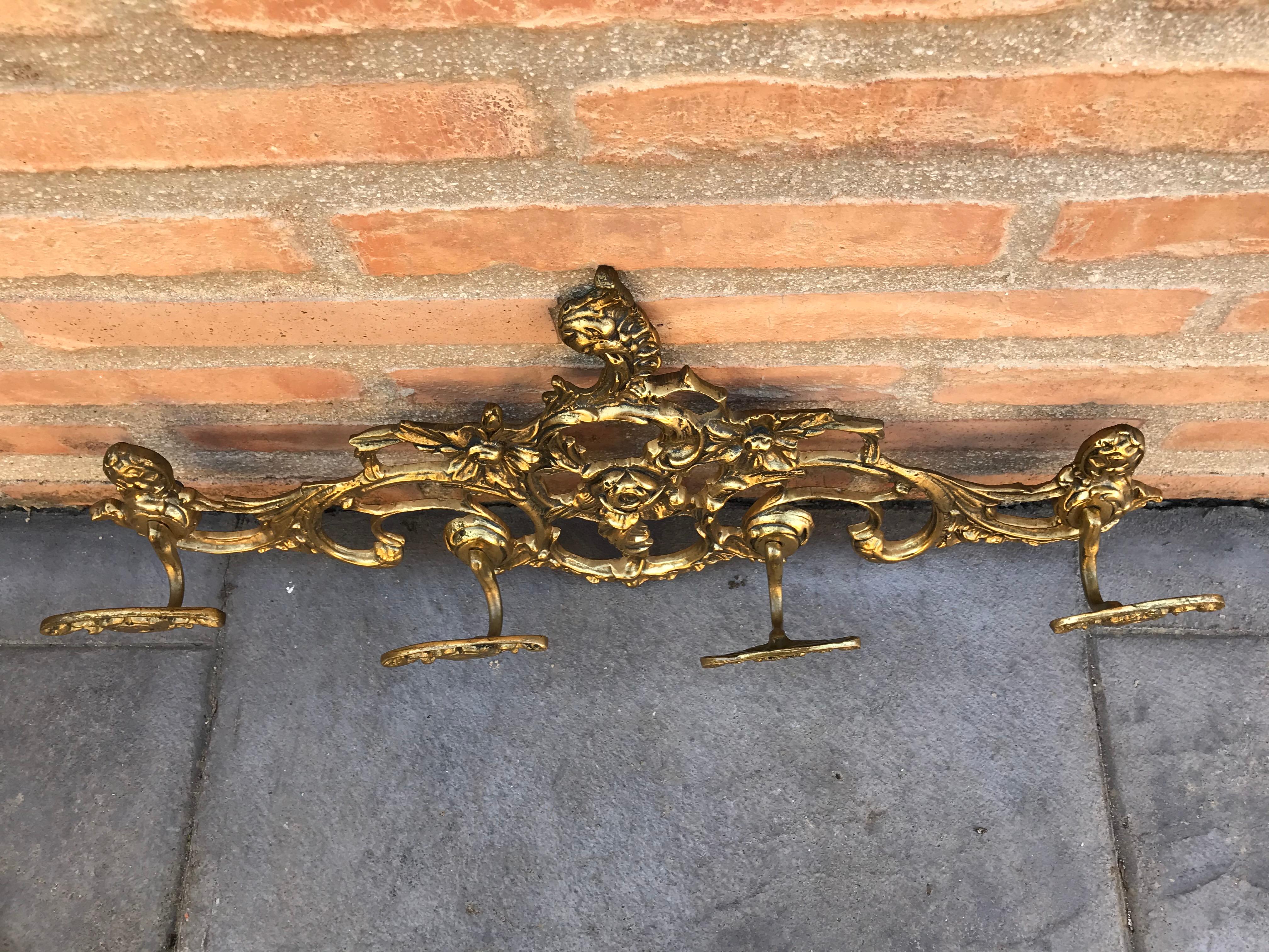 20th century French bronze wall-mounted coat rack four hangers.

     