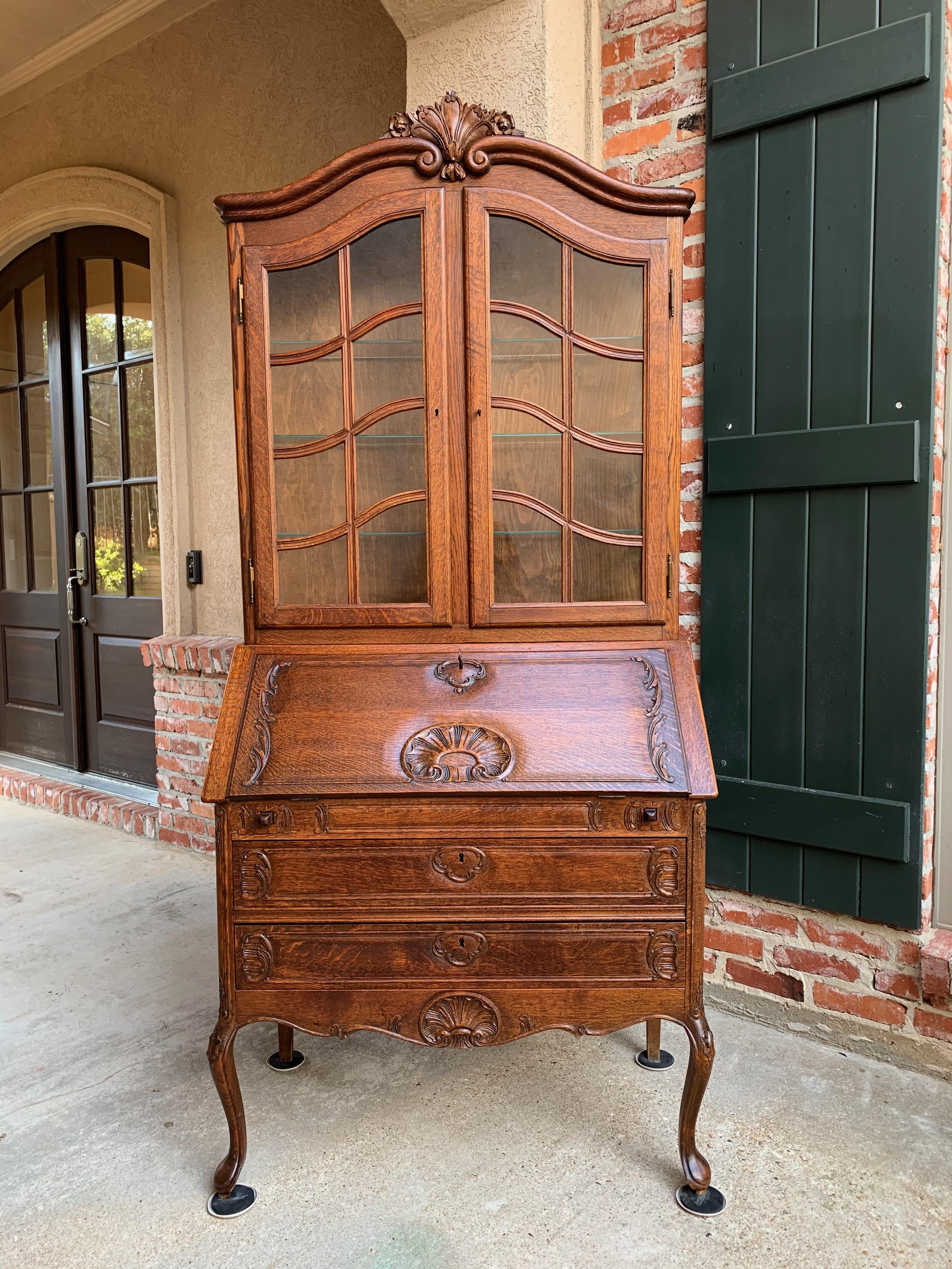 Direct from France, a lovely vintage French carved “drop front” secretary, absolutely loaded with carvings and details!~
~Quintessential French style from the large upper carved shell crown all the way to the lower serpentine base with carved shell