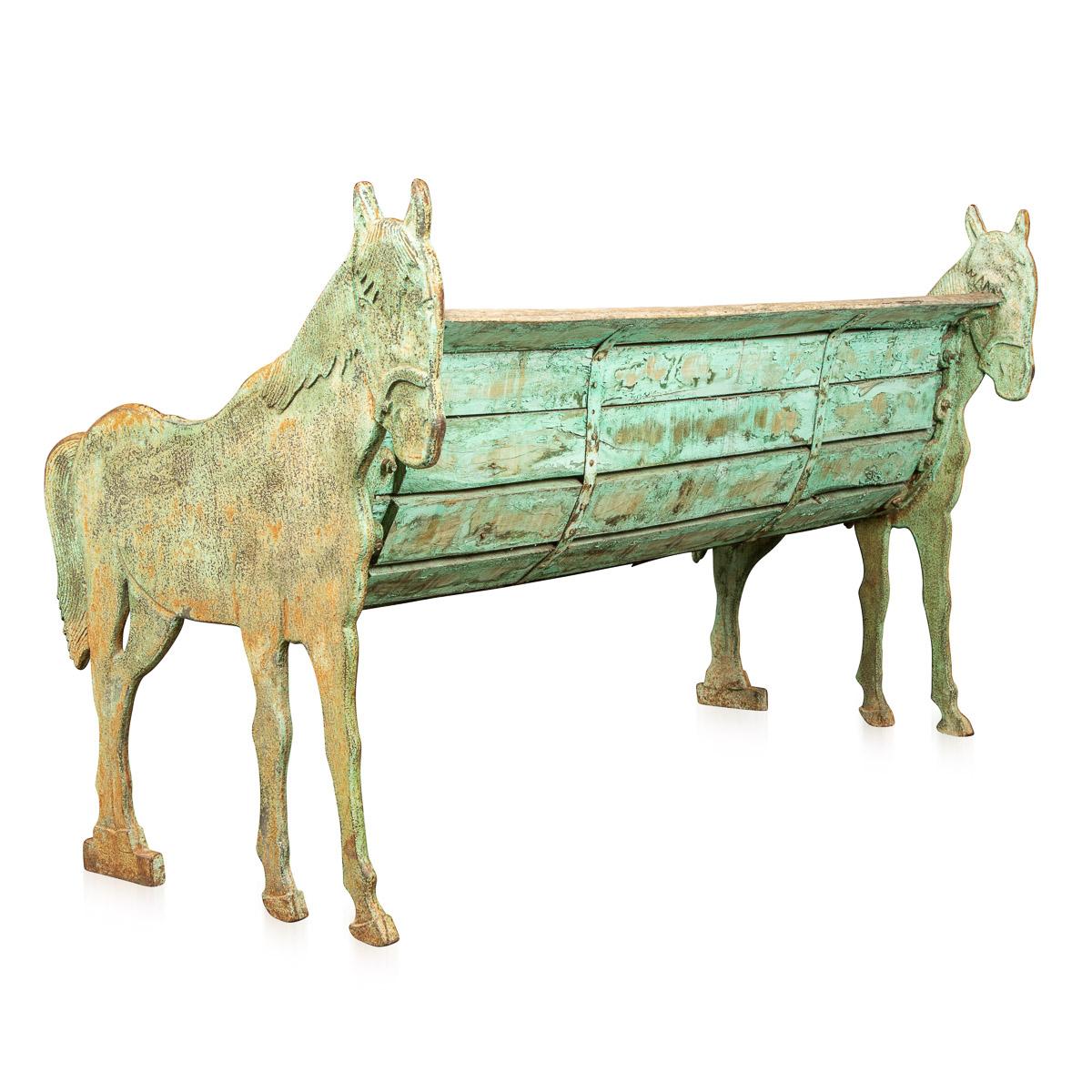 Antique early-20th century French garden bench with verdi gris cast iron ponies at either end of the wooden bench c.1900.

Condition
In fair condition - wear and tear consistent with age.

Size
Width: 70cm
Depth: 43cm
Height: 90cm
Seat