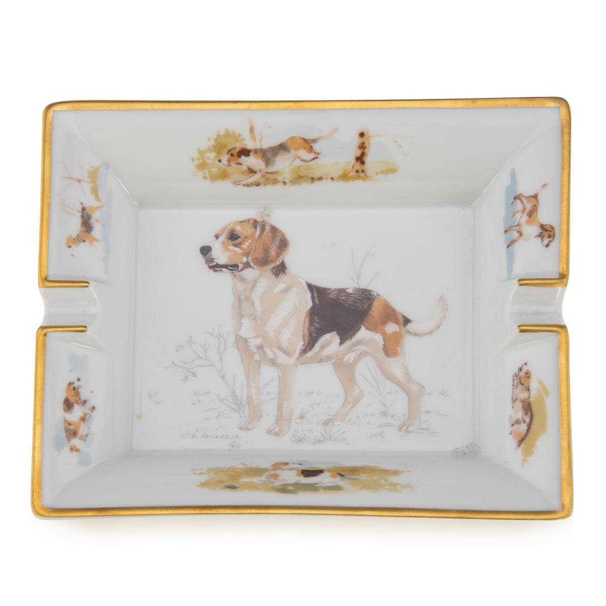 A ceramic ashtray by Hermes, made in France in the latter half of the 20th century. These ashtrays have always been very collectable with the vintage models in particular. This one has a lovely dog theme, probably a beagle, but at the same time