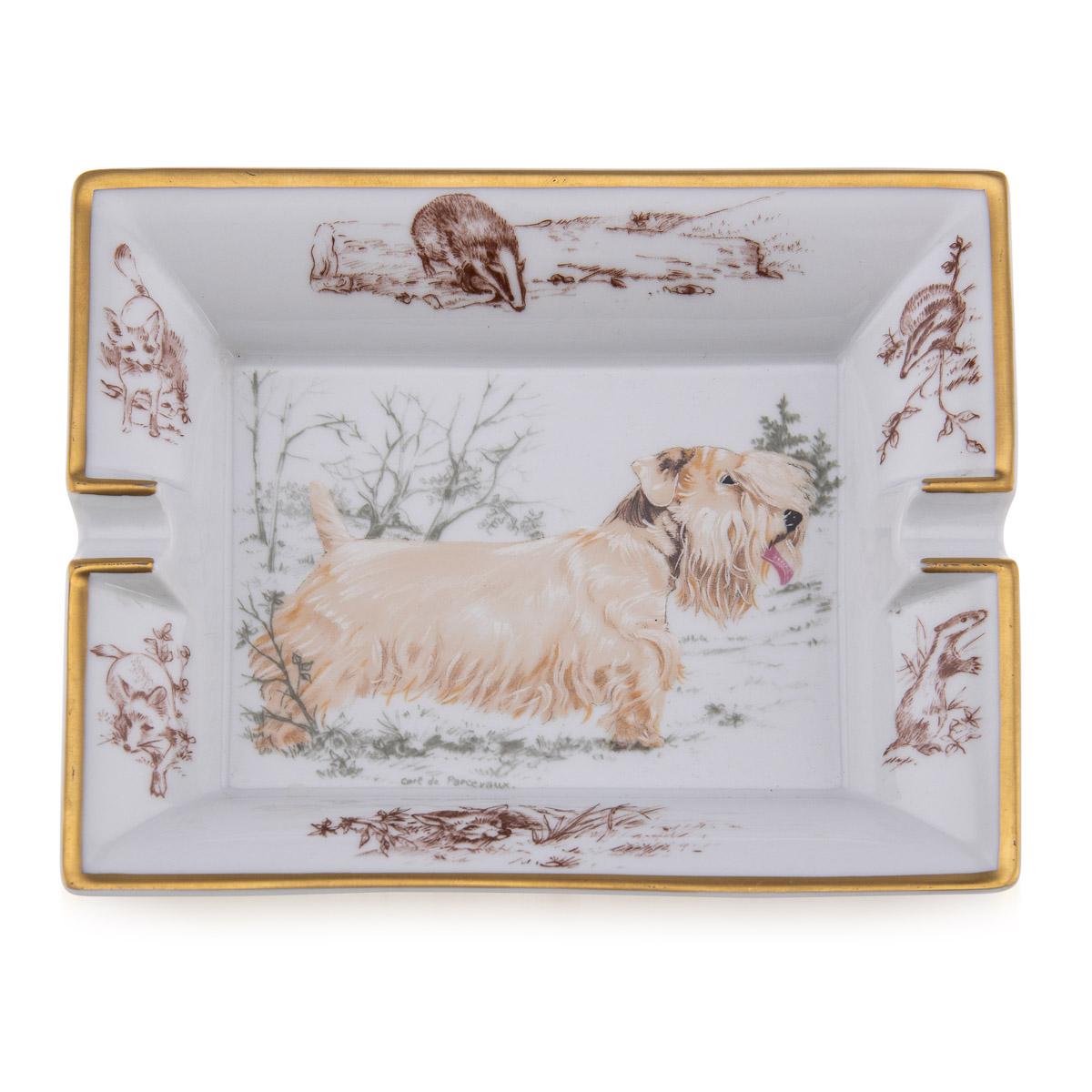 A ceramic ashtray by Hermes, made in France in the latter half of the 20th century. These ashtrays have always been very collectable with the vintage models in particular. This one has a lovely dog theme but at the same time typically Hermes; a