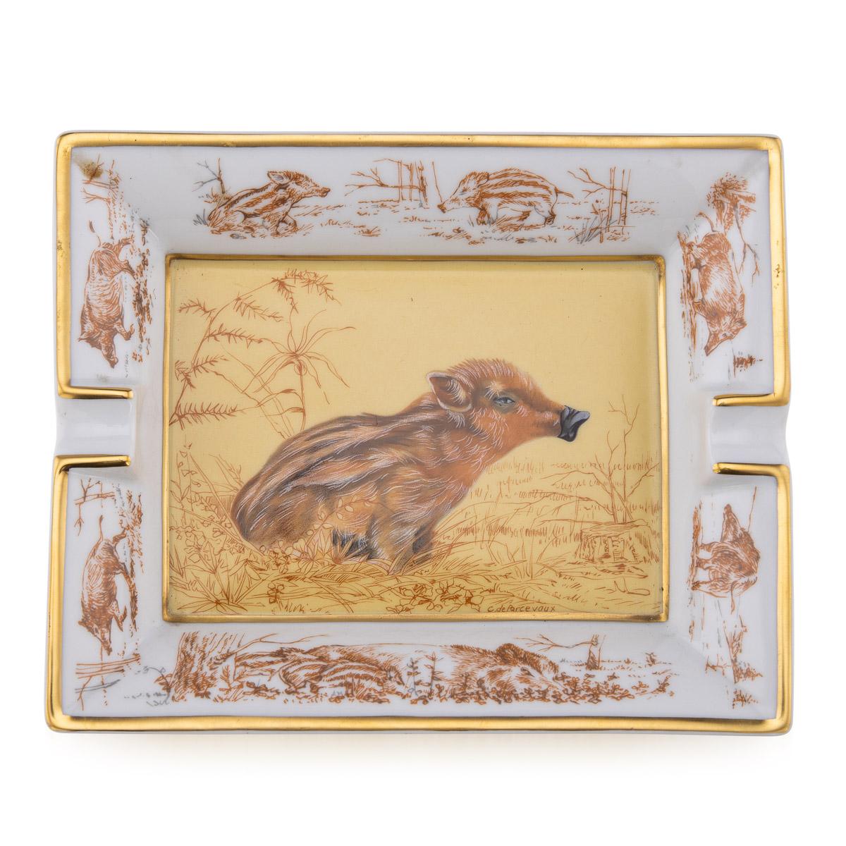 A ceramic ashtray by Hermes, made in France in the latter half of the 20th century. These ashtrays have always been very collectable with the vintage models in particular. This one has a lovely wild boar theme but at the same time typically Hermes;