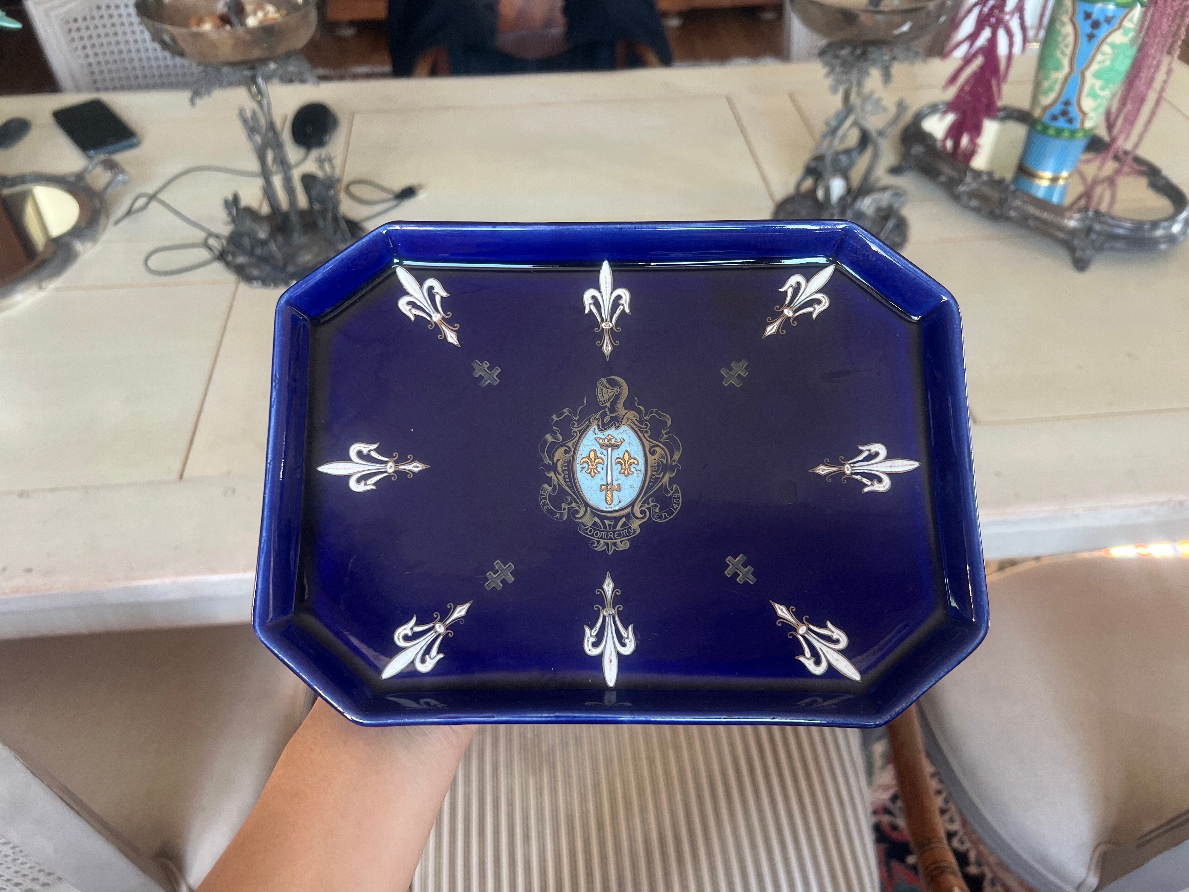 French handmade ceramic pieces in blue with hand made decoration.
France, circa 1920