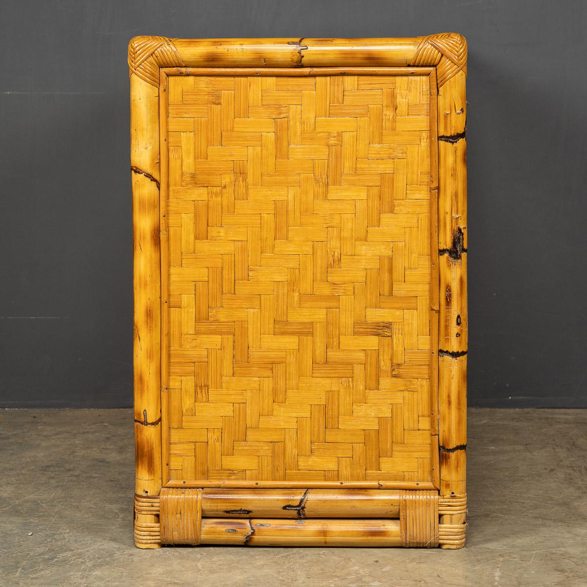 A mid 20th Century French chest of four drawers in bamboo and woven raffia detail with original brass handles.

CONDITION
In great condition, wear as expected.

SIZE
Width: 98cm
Height: 74cm
Depth: 49cm.