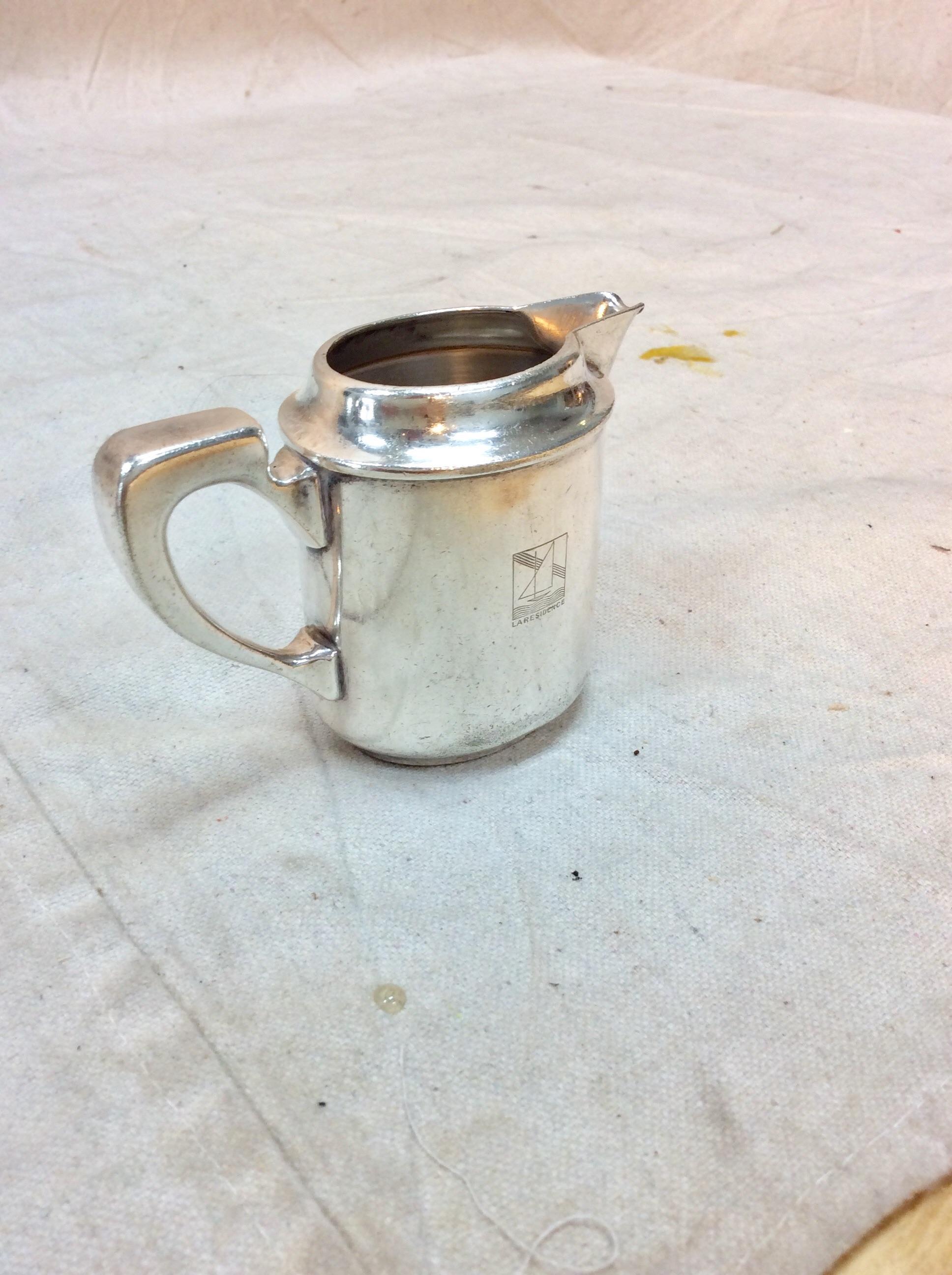 Found in the South of France, this 20th Century Hotel Silver Silverplate Creamer was manufactured by Christofle and produced for the La Residence Hotel. The piece is hallmarked on the side with an emblem that is most likely the hotel logo with La