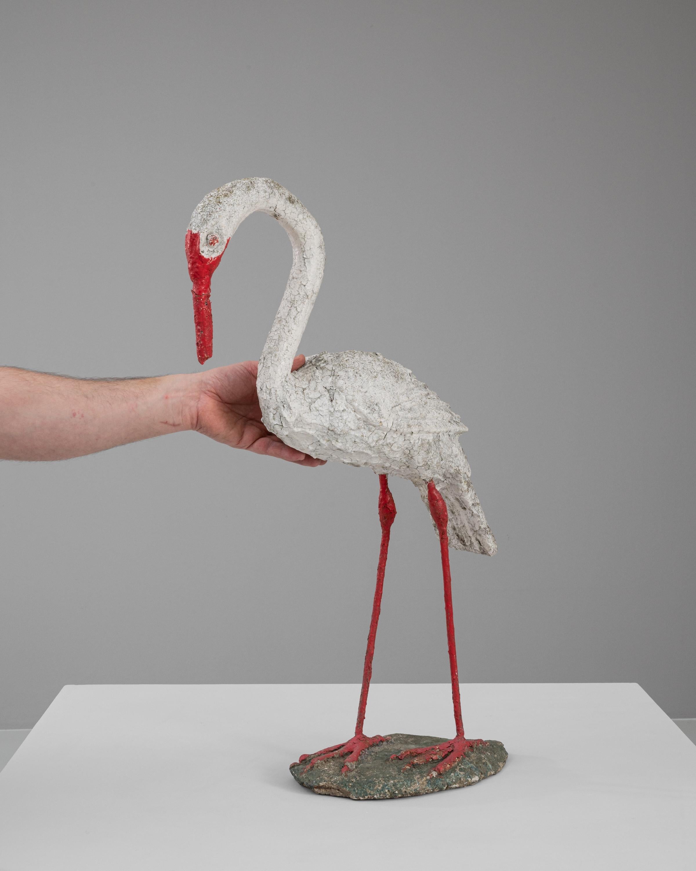 This 20th Century French Concrete Sculpture presents a strikingly abstract rendition of a flamingo, bringing a unique artistic touch to any space. Crafted from concrete, the sculpture captures the essence of the bird with a minimalist approach,