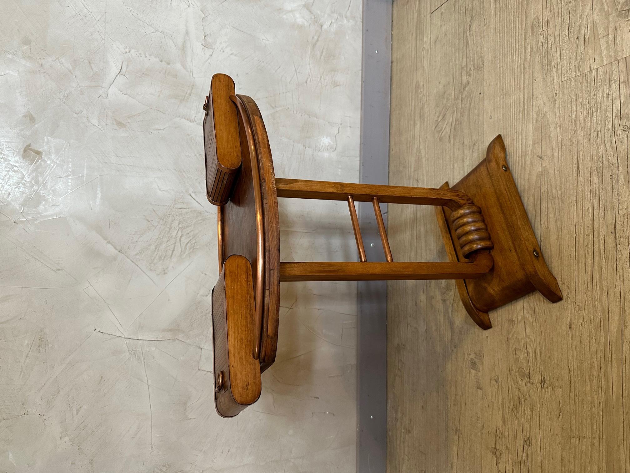 Small copper and wooden  smoker's side table from the 1950s in good condition. Two small drawers with pulls that can hold cigarettes. 
Very original. Uncommon item. 
